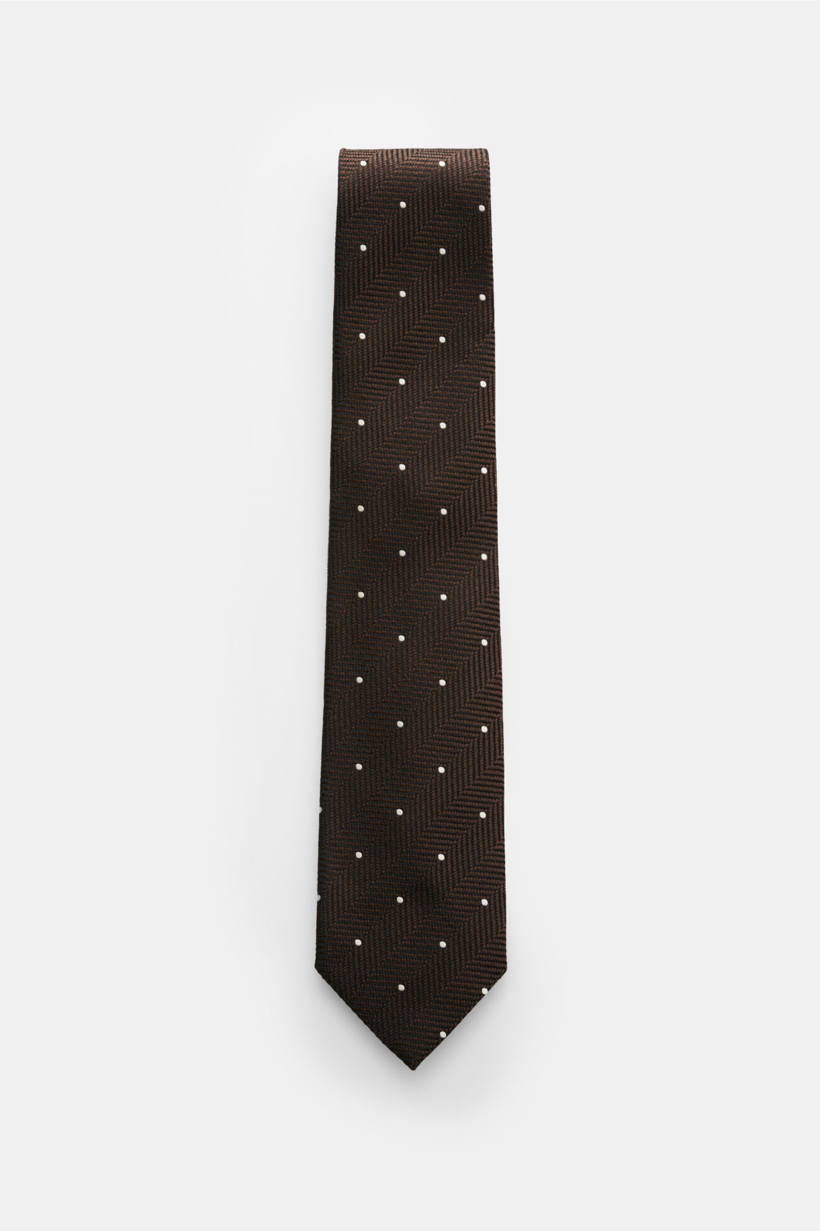 Tom Ford Seidenkrawatte dunkelbraun/schwarz/creme gemustert, frontal fotografiert, reine Seide, dezenter Glanz, Fischgrat mit Punkten, 8 cm breit, made in Italy.