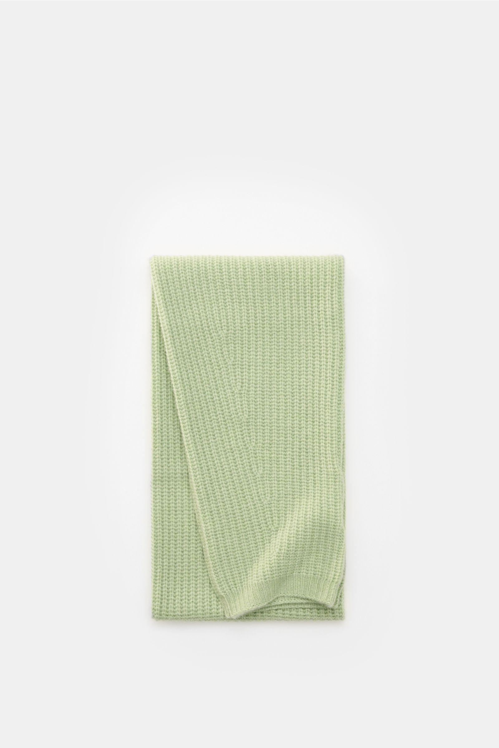 Folded Lisa Yang Cashmere scarf 'Marseille' light green with distinctive ribbed texture, photographed from above on white background.