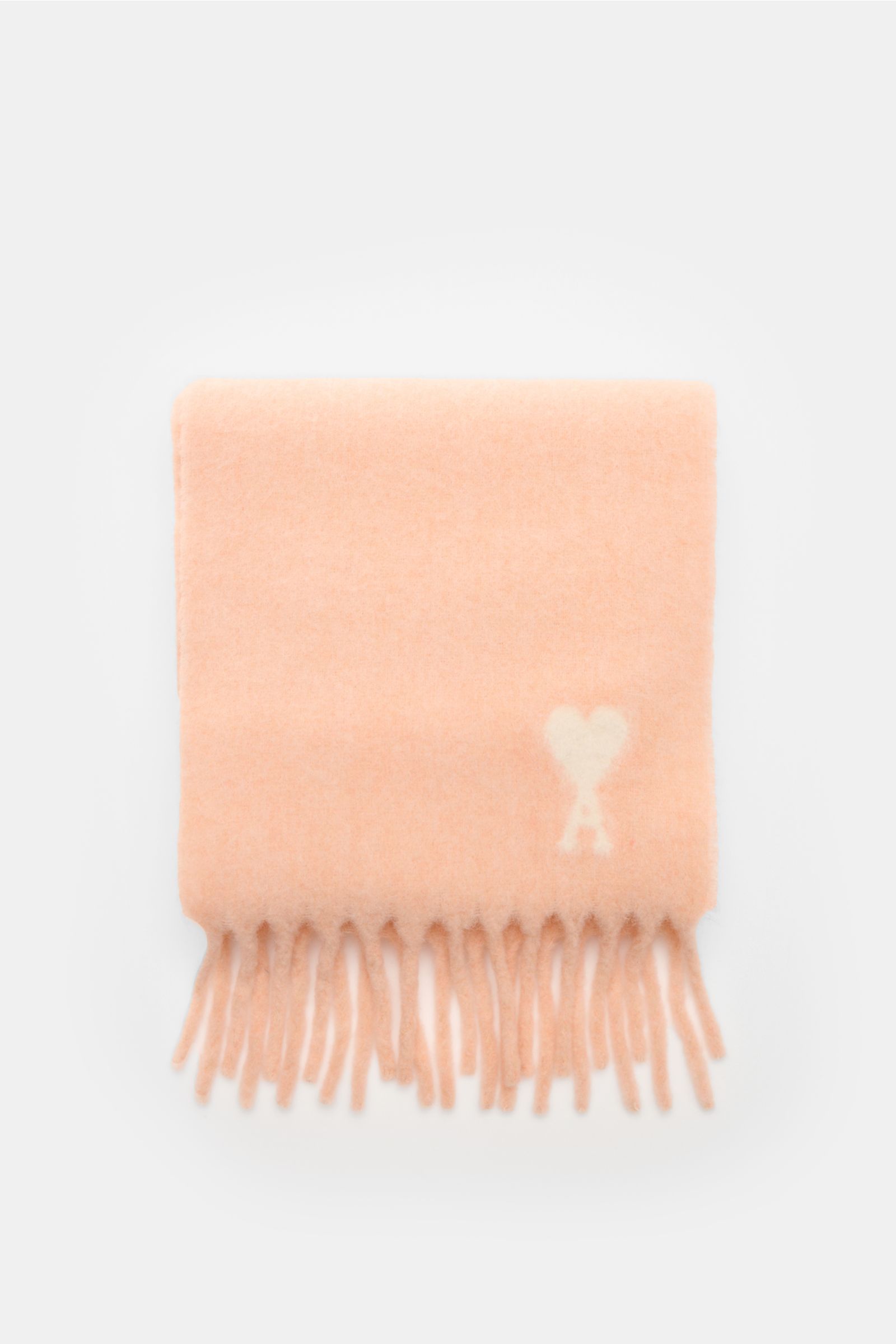 Ami Paris Scarf rose folded flat, photographed from above, showing soft alpaca wool blend with fringed edges and signature heart logo. 

A minimalist classic: This long scarf by AMI PARIS in a super soft alpaca wool blend with signature monogram perfec