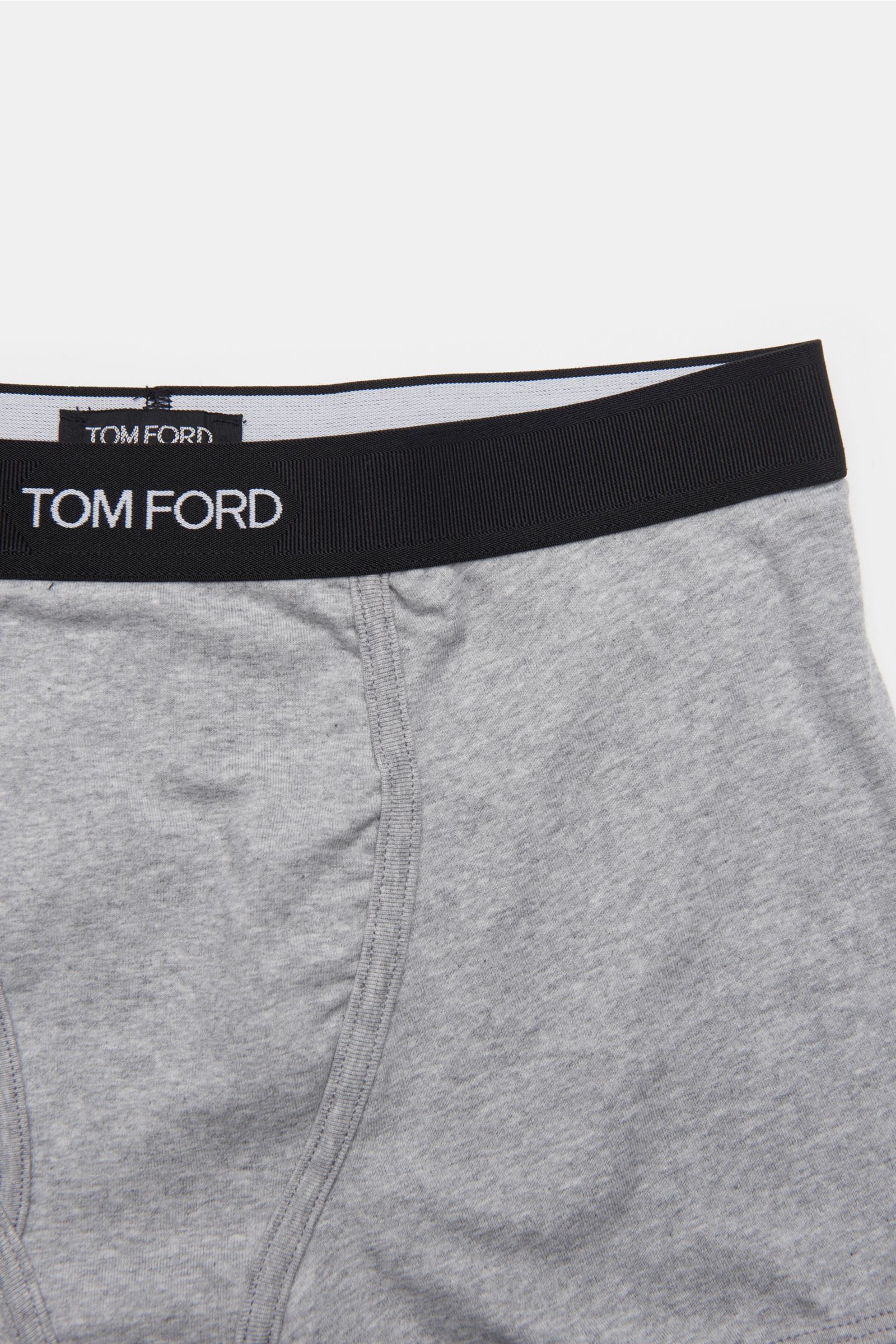 Close-up top view of Tom Ford Boxer shorts grey showing black elastic waistband with TOM FORD stitching, keyhole fly, slim fit elastic cotton fabric. 

Description: Sporty, simple and luxurious: These comfortable boxer shorts with practical opening and TO