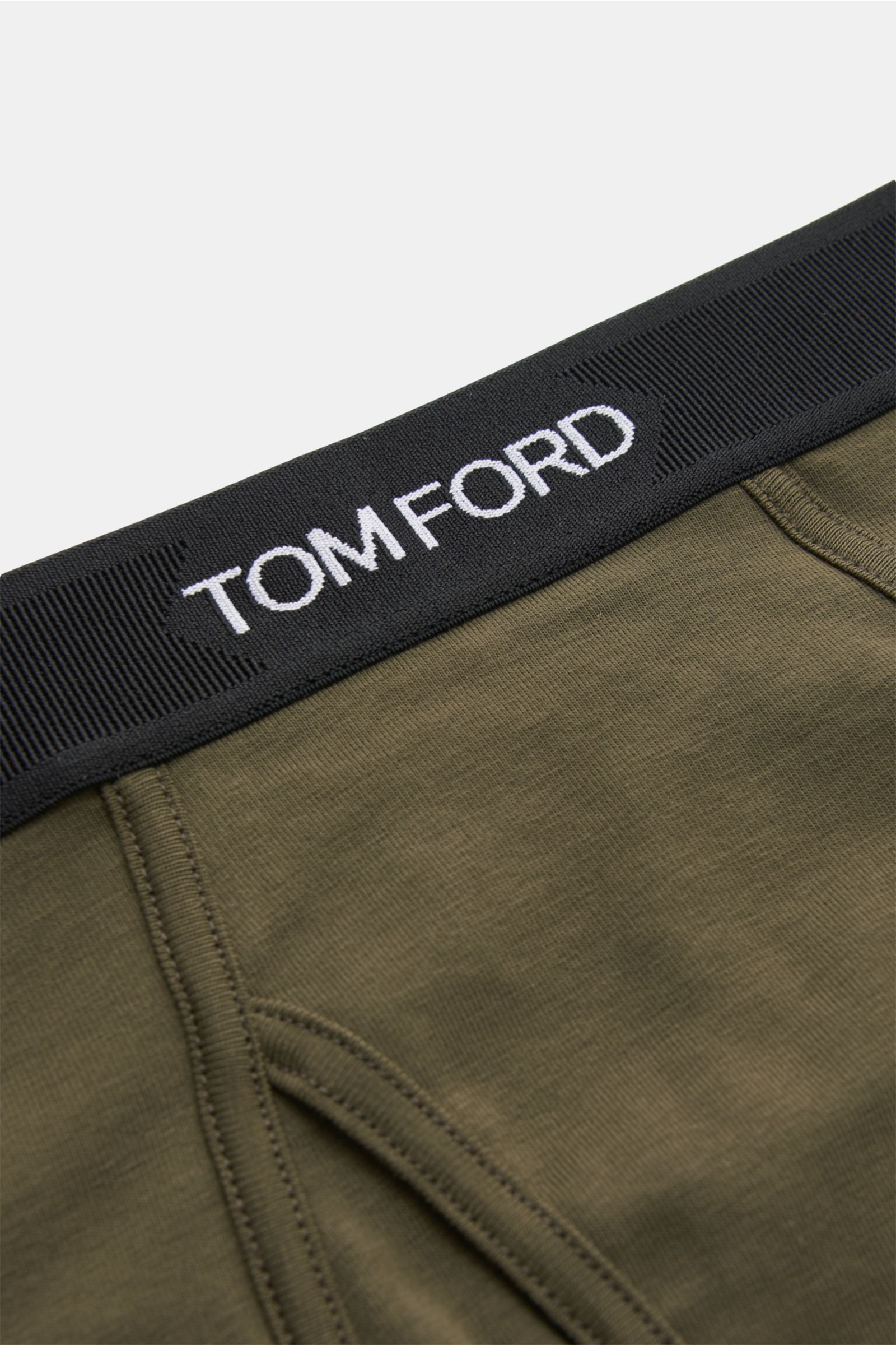 Tom Ford Sport Slip dark olive aus elastischer Baumwolle mit weichem Griff, Slim Fit, elastischem Bund und seitlichem Eingriff, Nahaufnahme von oben.