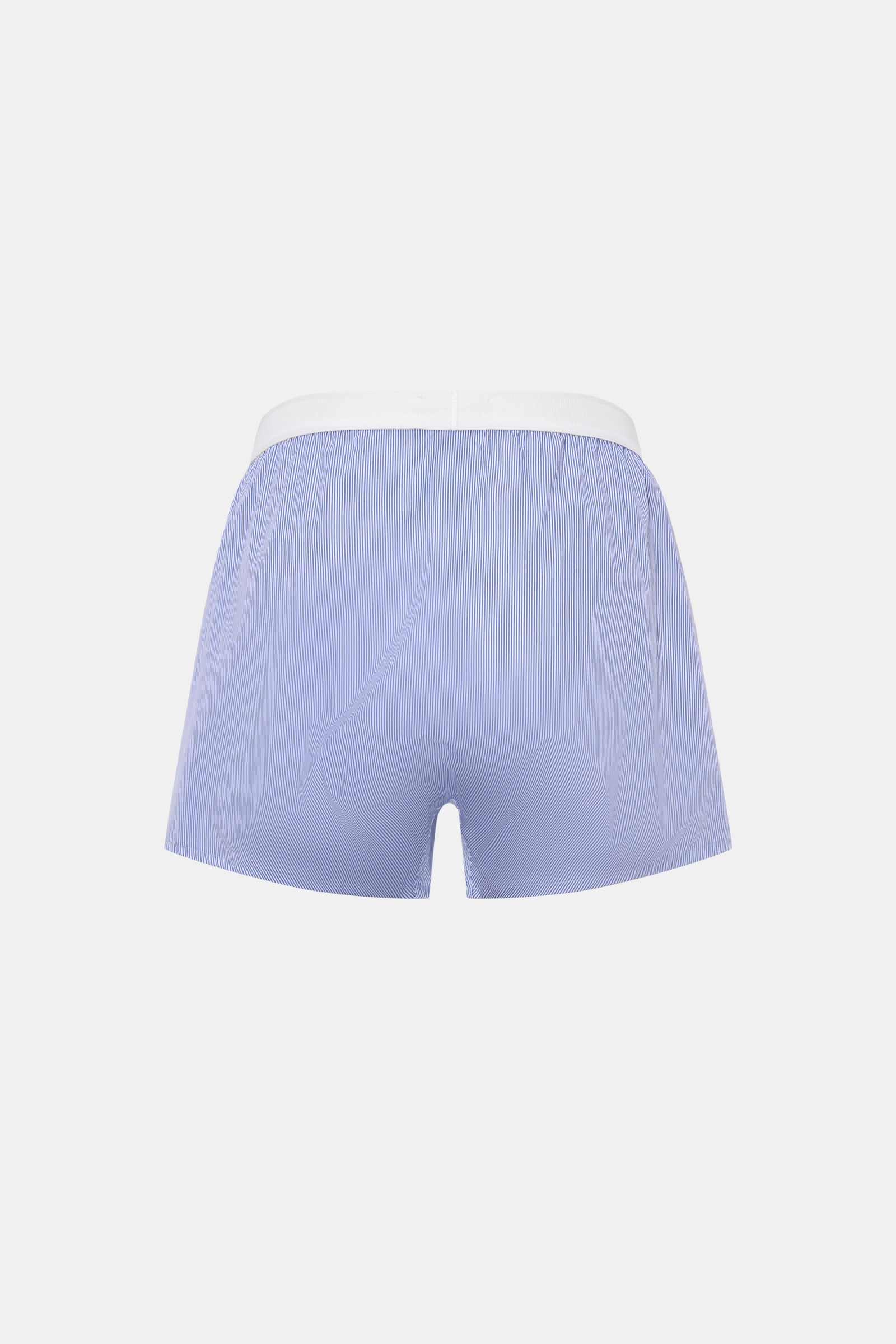 Rear view of Tom Ford Boxershorts dunkelblau/weiß gestreift, slim fit with fine blue and white stripes, elastic white waistband featuring TOM FORD logo, made from a cotton and microfiber blend, smooth texture, and side opening. Sportlich, clean und luxuri