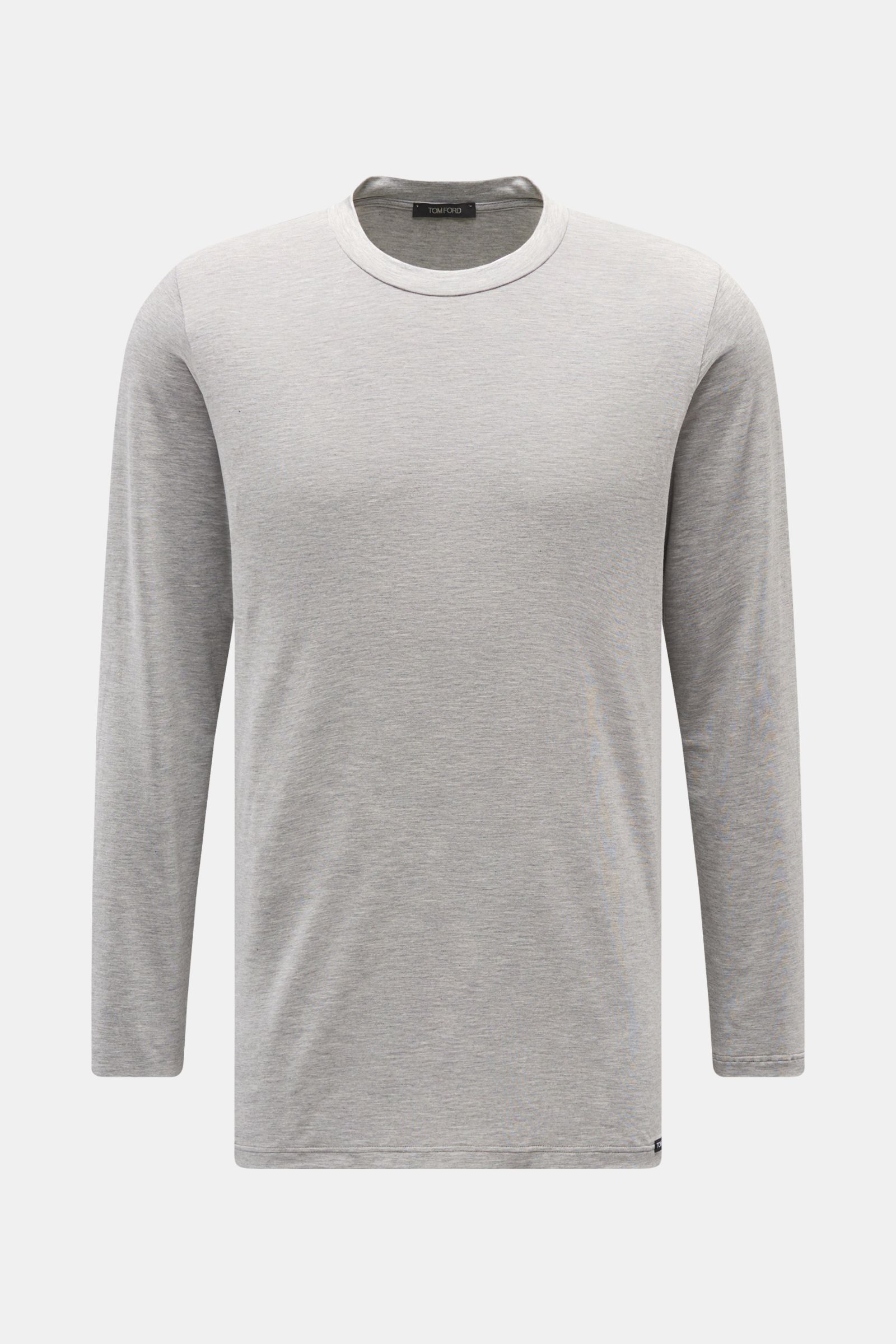 Front view of Tom Ford Langarm-Unterhemd schwarz, a clean basic long-sleeve shirt with round neckline, made from a soft cotton-modal blend, regular fit, featuring a small TOM FORD label at the hem. 

Description: Cleanes Basic mit Rundhalsausschnitt: D