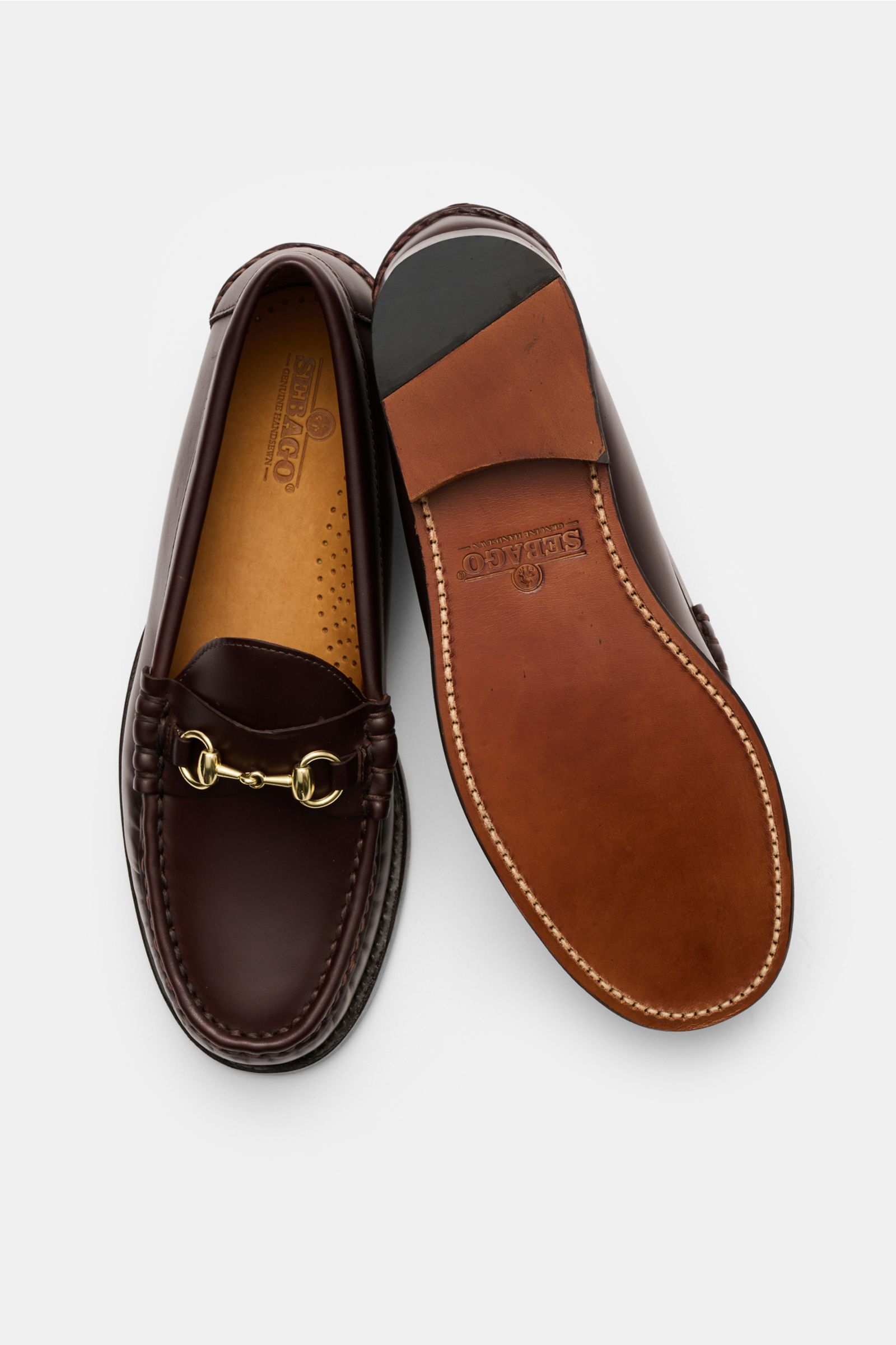 Sebago Horsebit Loafer 'Joe Modena' rotbraun, aus fein genarbtem Leder, mit Horsebit-Detail, Lederlaufsohle, von oben und unten gezeigt.