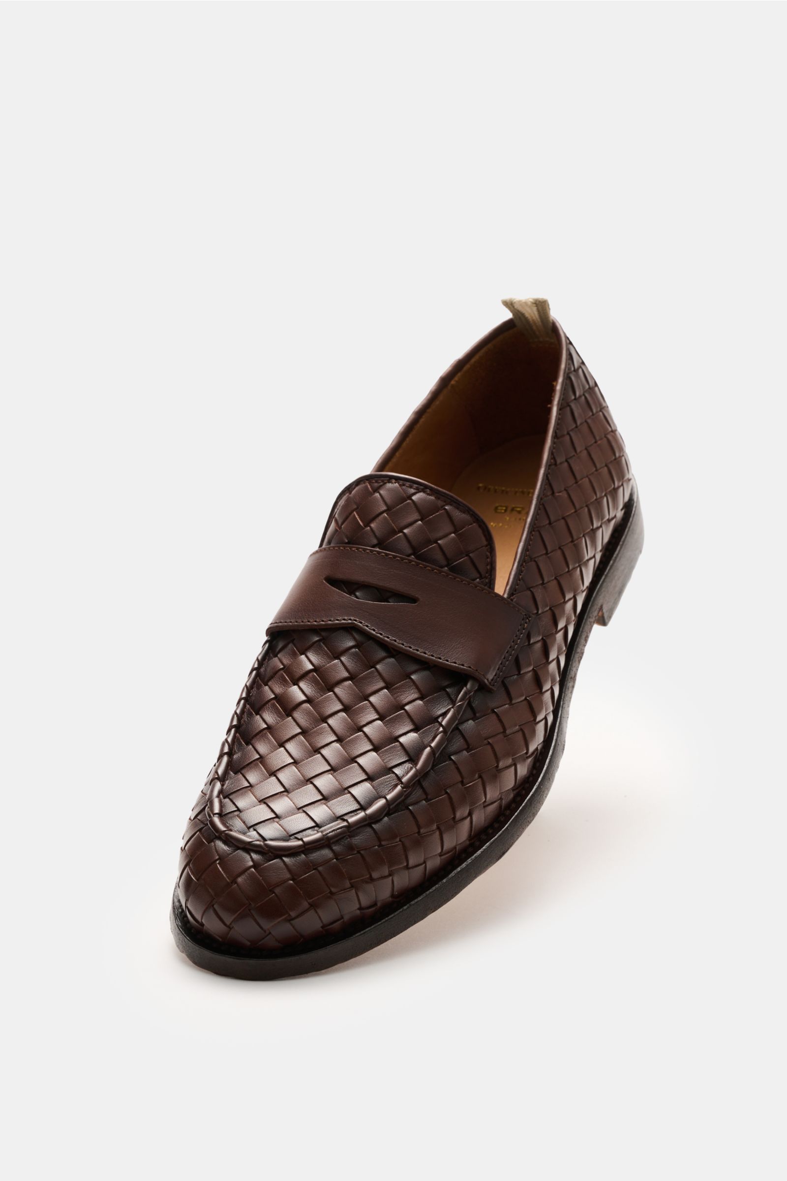 Officine Creative Penny Loafer 'Opera' braun shown from a front-side angle, featuring woven velour leather, penny strap, Blake construction, decorative stitching, leather lining, and leather sole.