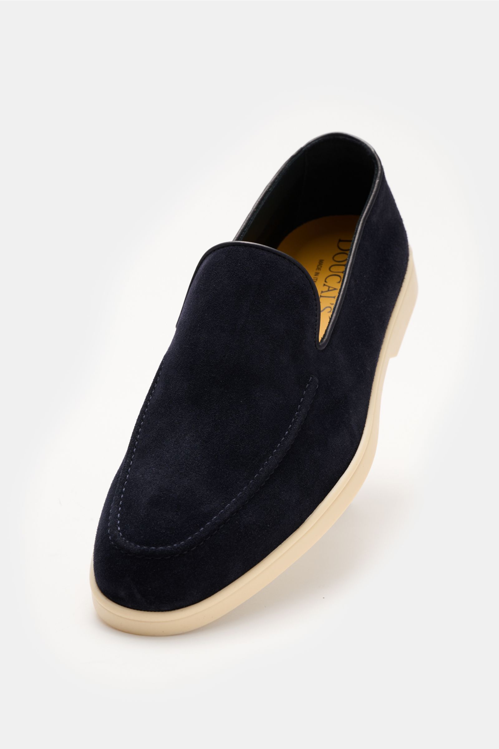 Front angled view of Doucal's Loafer 'Reverse' navy in fine navy velour leather with a stitched toe cap, leather lining, and light rubber sole.