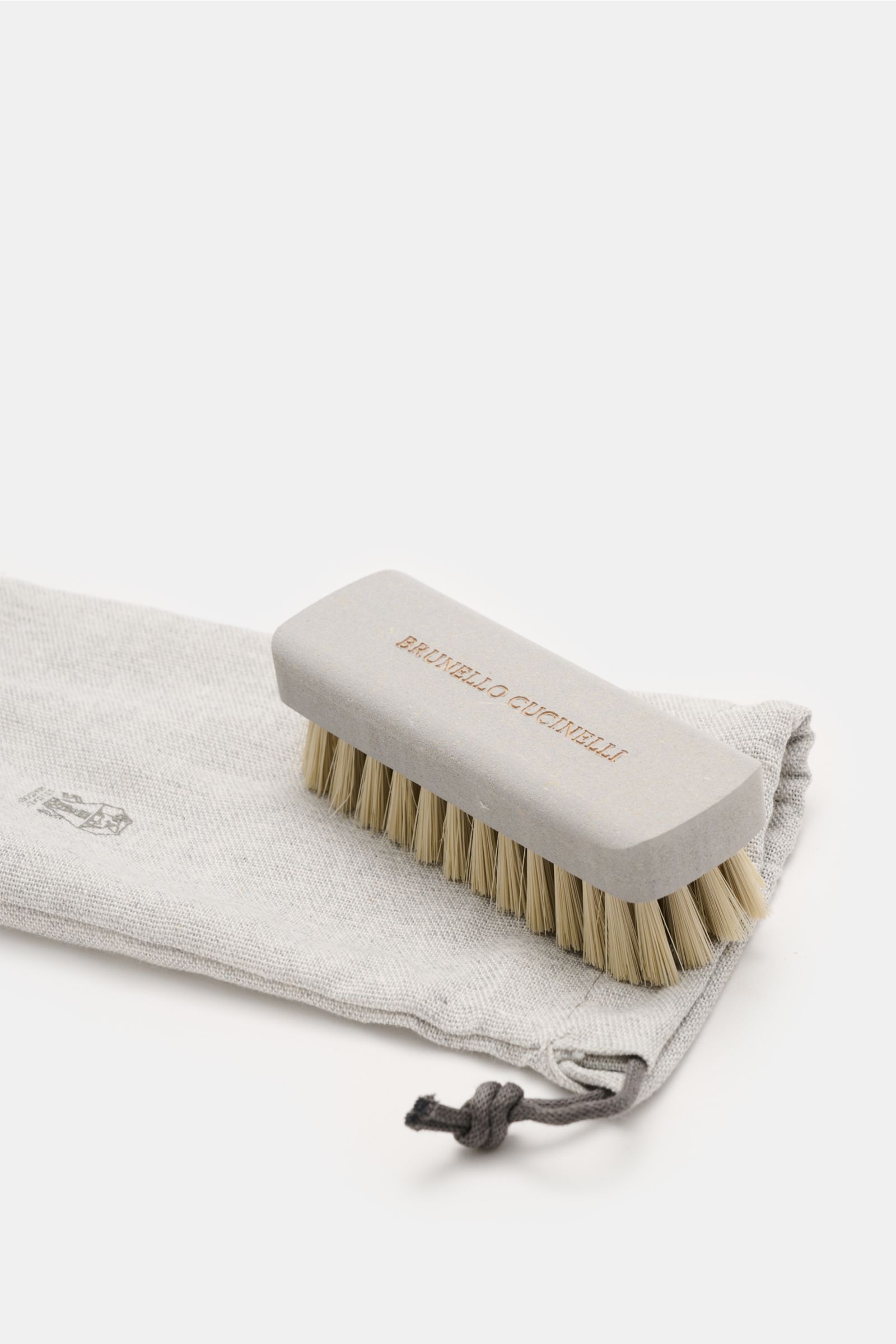 Brunello Cucinelli Penny Loafer beige shown from a close-up side angle, featuring smooth beige velour leather, Goodyear-welted, narrow tapered shape, typical penny strap, leather lining, and flexible leather sole, embodying stylish casualness with ultrali