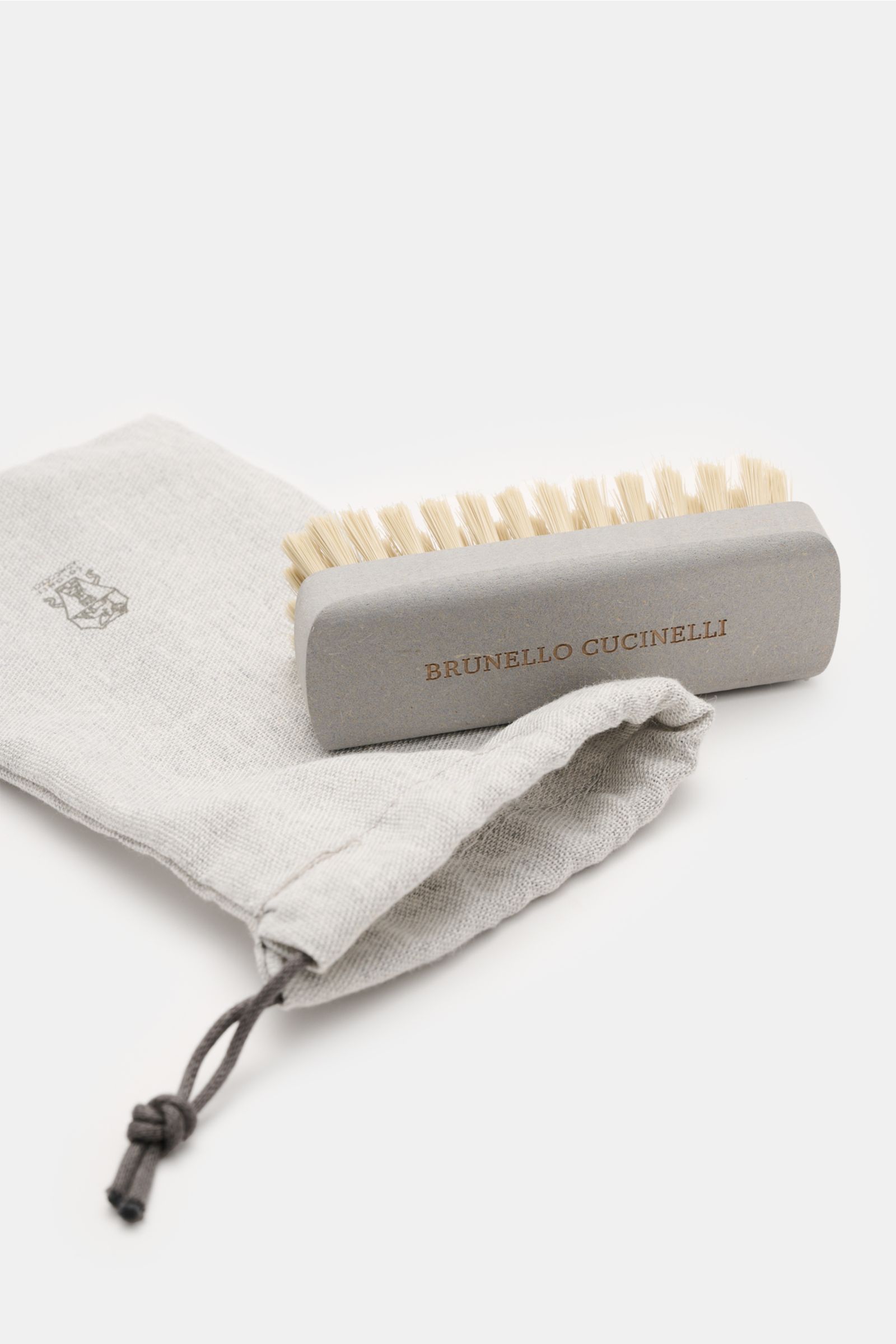 Taupe Brunello Cucinelli Penny Loafer shown from a side angle highlighting its soft velour leather, slim shape, penny strap, lightweight construction, fine sole edge, and rubber outsole.