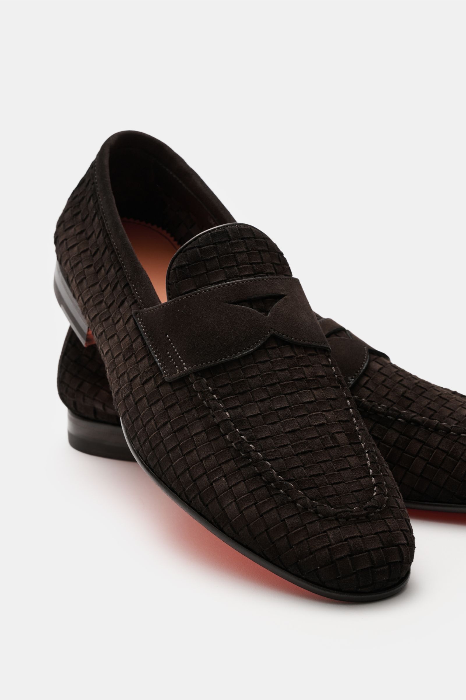 Santoni Penny loafers 'Carlo' dark brown shown from a close-up front side angle, featuring braided suede, tapered silhouette, toe cap with decorative stitching, signature penny strap, leather lining, and leather sole with rubber-reinforced heel. Perfect y