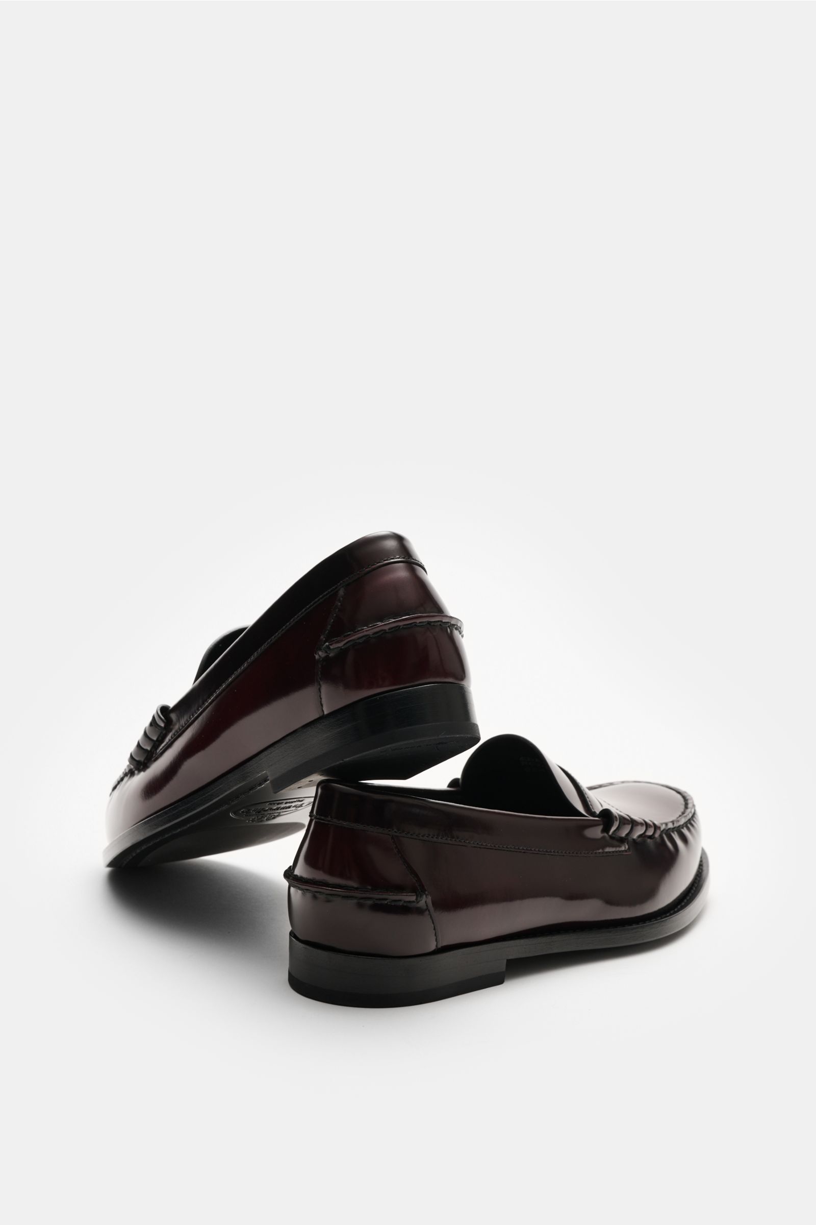 Rear and side view of Church's Penny Loafer 'Rowley' bordeaux in polished smooth leather with typical penny strap, decorative stitching, leather lining, leather sole, rubber-reinforced heel, Goodyear welted and a slightly tapered silhouette, perfect for s