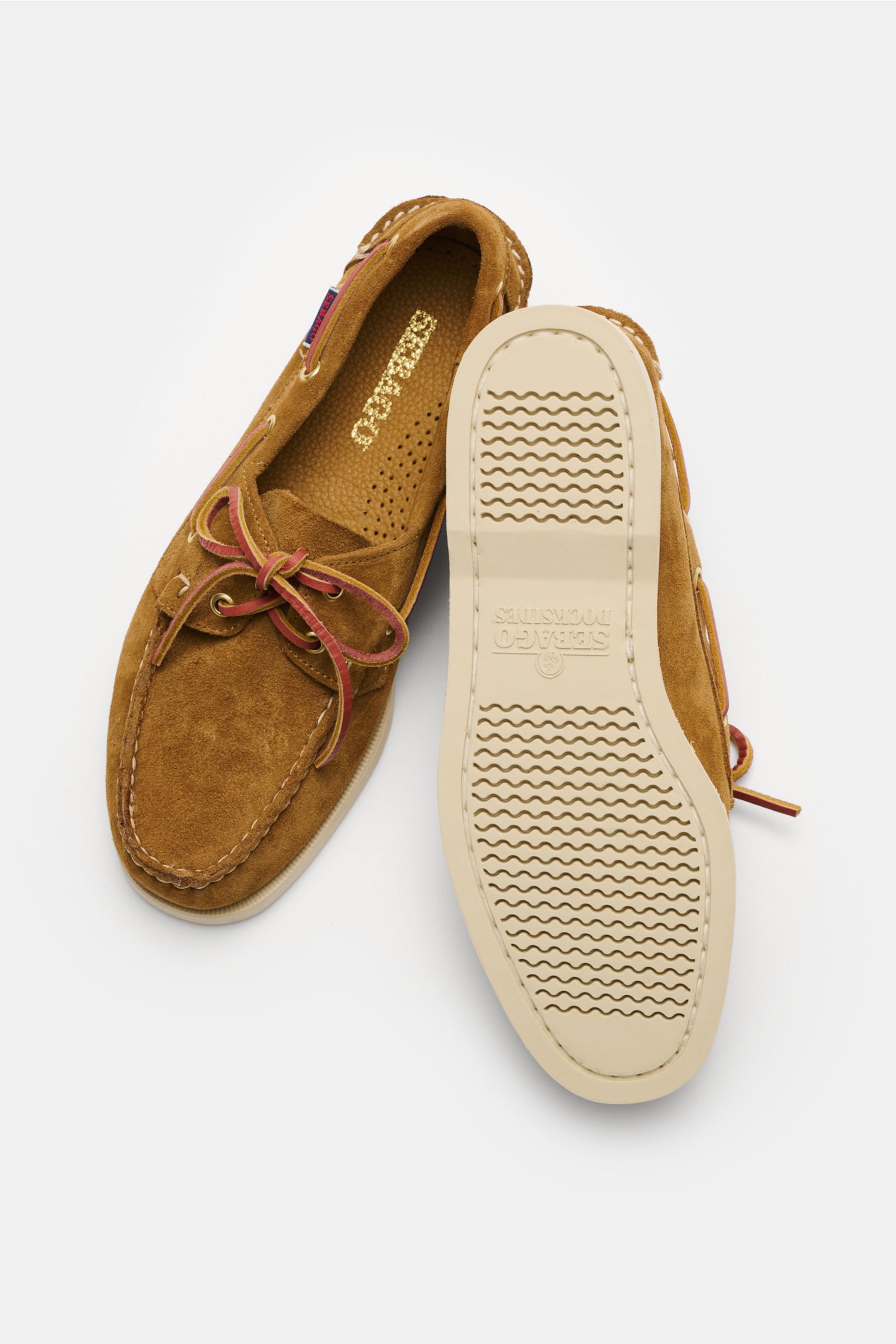 Top view of Sebago Loafer 'Portland Artisan' camel in smooth suede with a narrow silhouette, leather laces, decorative stitching, leather lining, and flexible rubber sole.