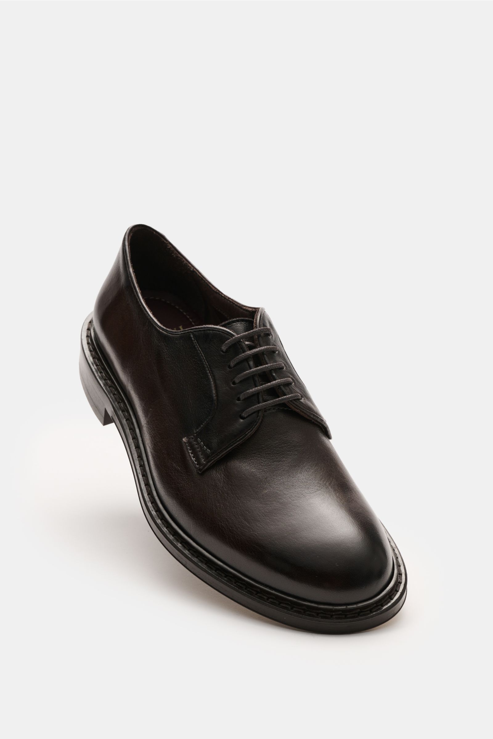 Front angled view of Sturlini Derby 'Bufalo' dunkelbraun in dark brown smooth leather with fine grain, Blake construction, open five-eyelet lacing, leather lining, leather and rubber sole with rubber-reinforced heel, showcasing elegant, slightly tapered s
