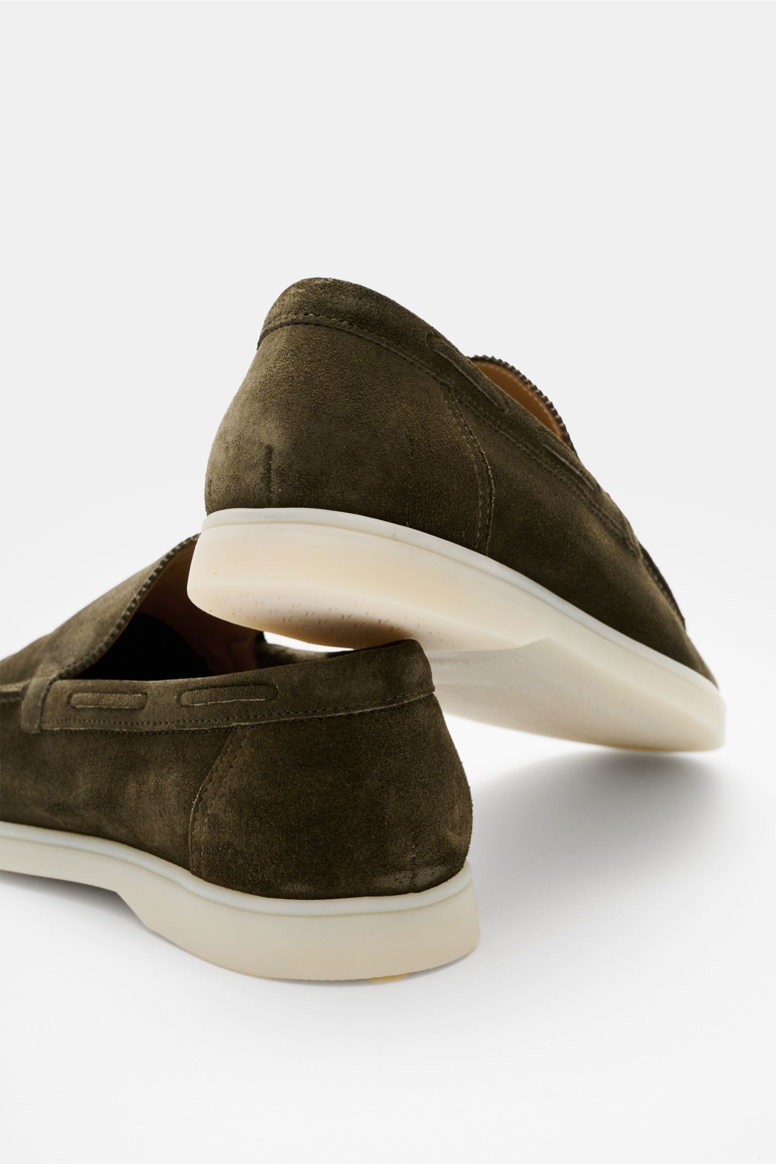 Rear and side view of Aurélien Loafer 'Yacht 2.0' dark olive in smooth suede, featuring a narrow silhouette, distinctive front seam, leather lining, and flexible white rubber sole. Versatile comfort, breathability, and flexibility with subtle zigzag edgin