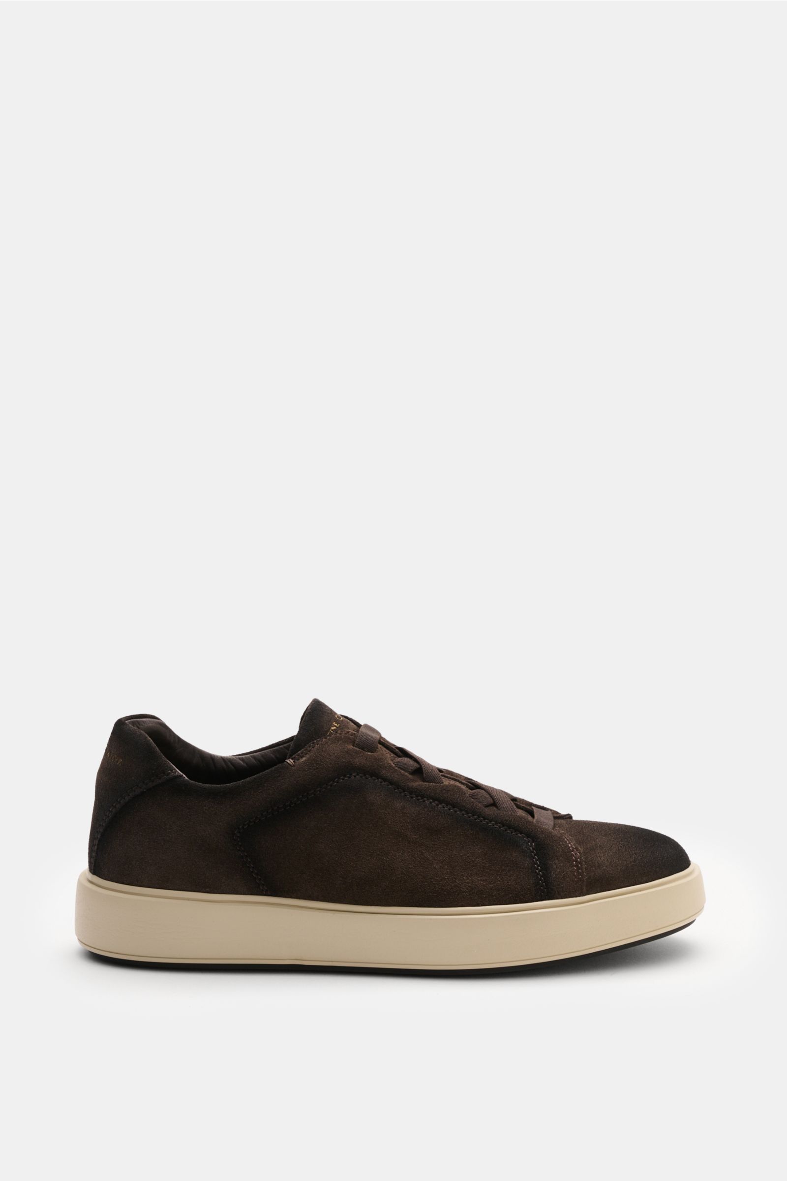 Officine Creative Slip-on-Sneaker 'Slouch 001' taupe shown from the side, featuring premium velour leather, round toe, elastic crossed bands, gold logo on tongue and heel, padded collar, leather lining, and lightweight rubber sole. When comfort meets time