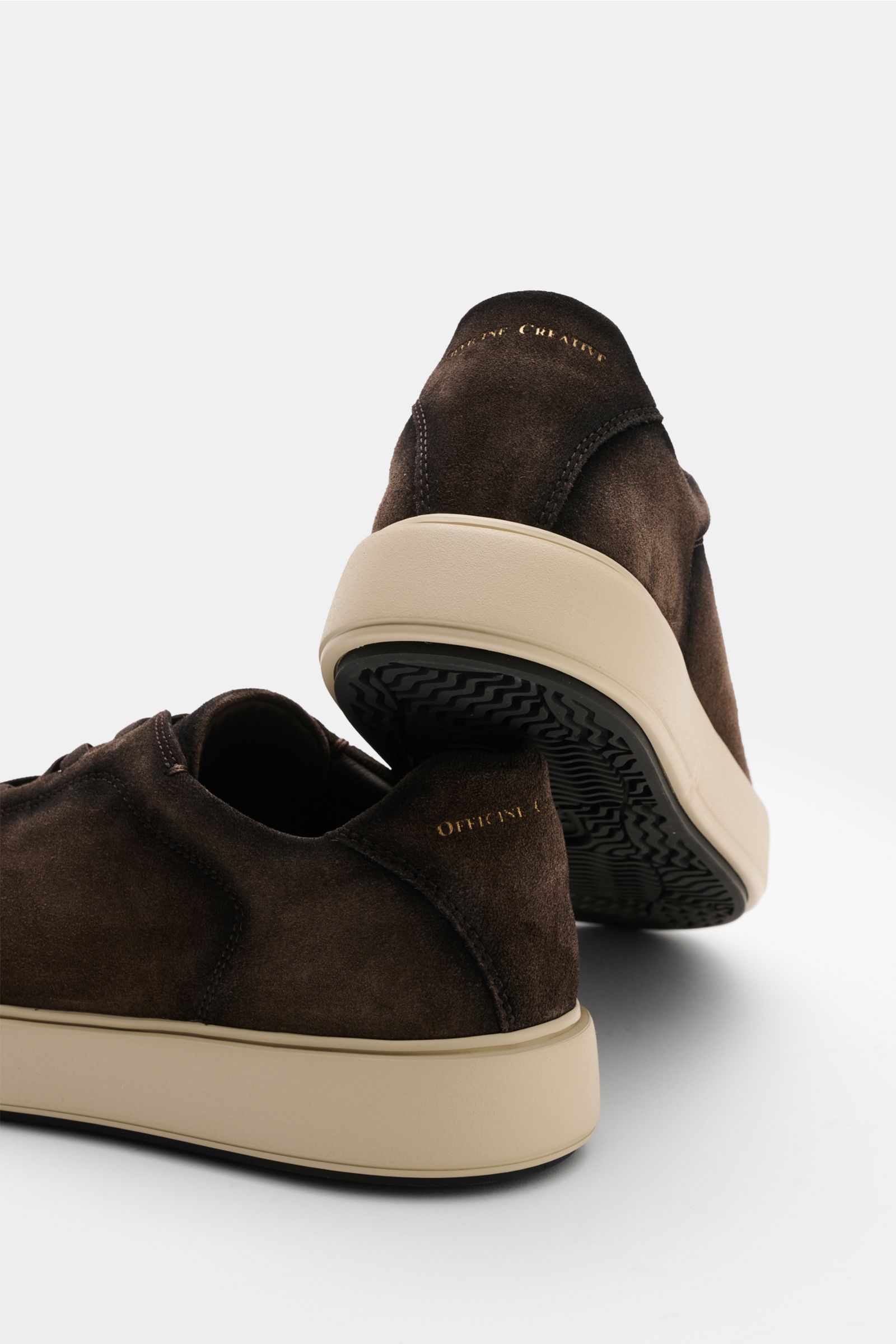 Rear-side view of Officine Creative Slip-on-Sneaker 'Slouch 001' taupe in suede with beige sole, gold logo, and padded collar.