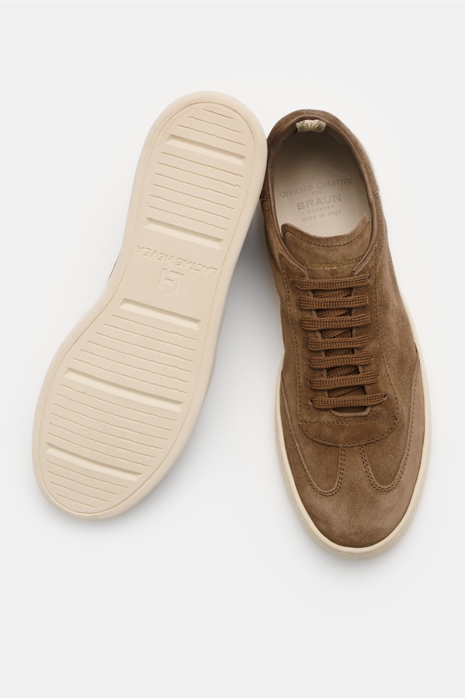 Top-down view of Officine Creative Sneakers 'Kafka' taupe in premium suede with round toe cap, wing cap, embossed logo on tongue and heel, high padded topline, leather lining, and lightweight rubber sole.

Description: For anyone who appreciates comfor