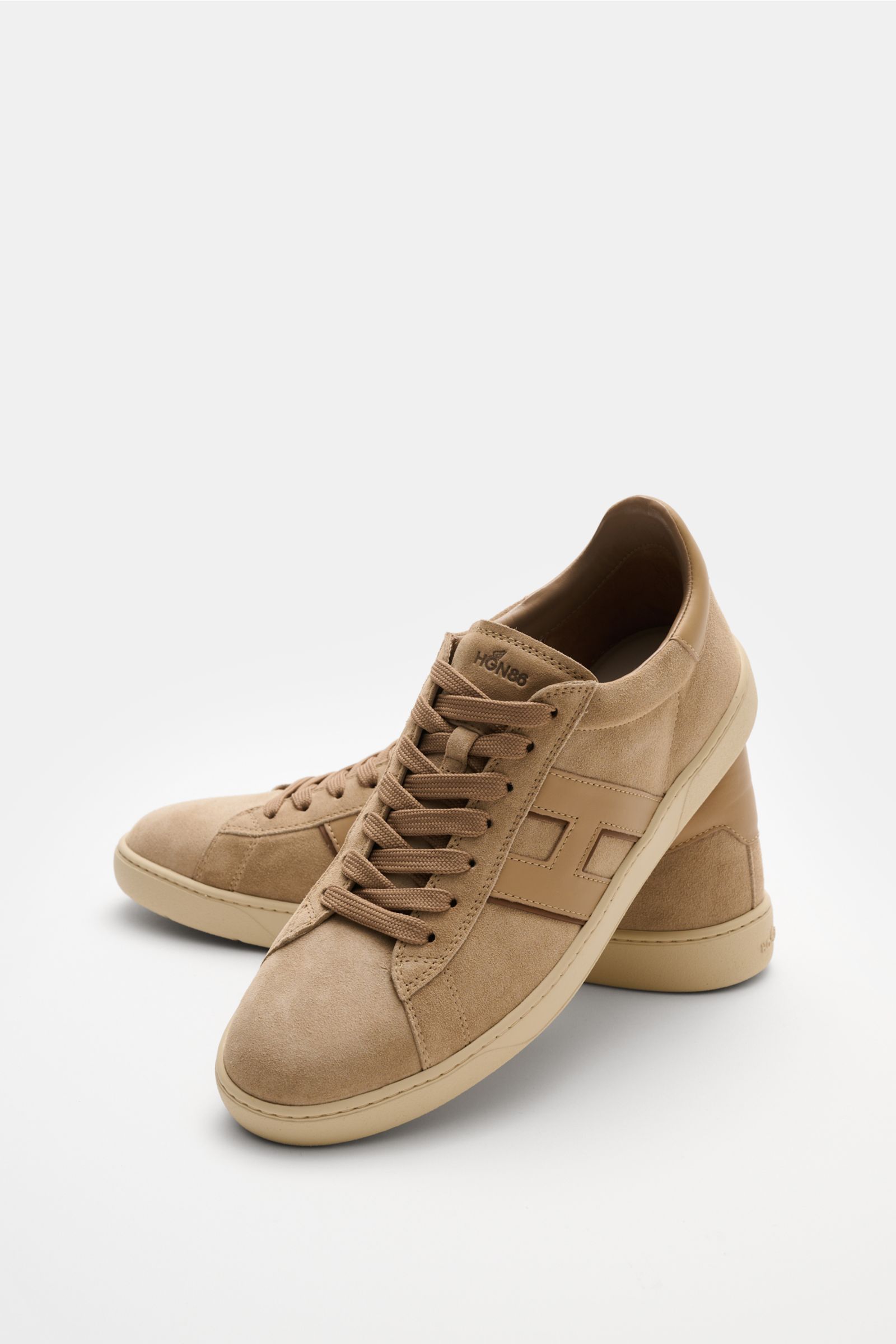 Front-side view of Hogan Sneaker 'Cool Allacciato' beige in soft suede with seven-hole lacing, smooth leather overlays, logo-printed tongue, padded collar, H-shaped brand initial, leather-textile lining, memory foam insole, and flexible rubber sole, class
