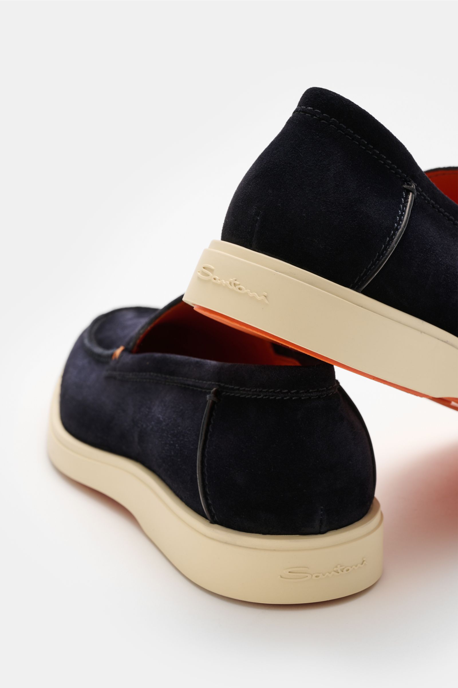 Rear view of Santoni Loafer 'Detroit' navy in soft navy suede with a light flexible rubber sole, narrow silhouette, decorative front stitching, and leather lining.