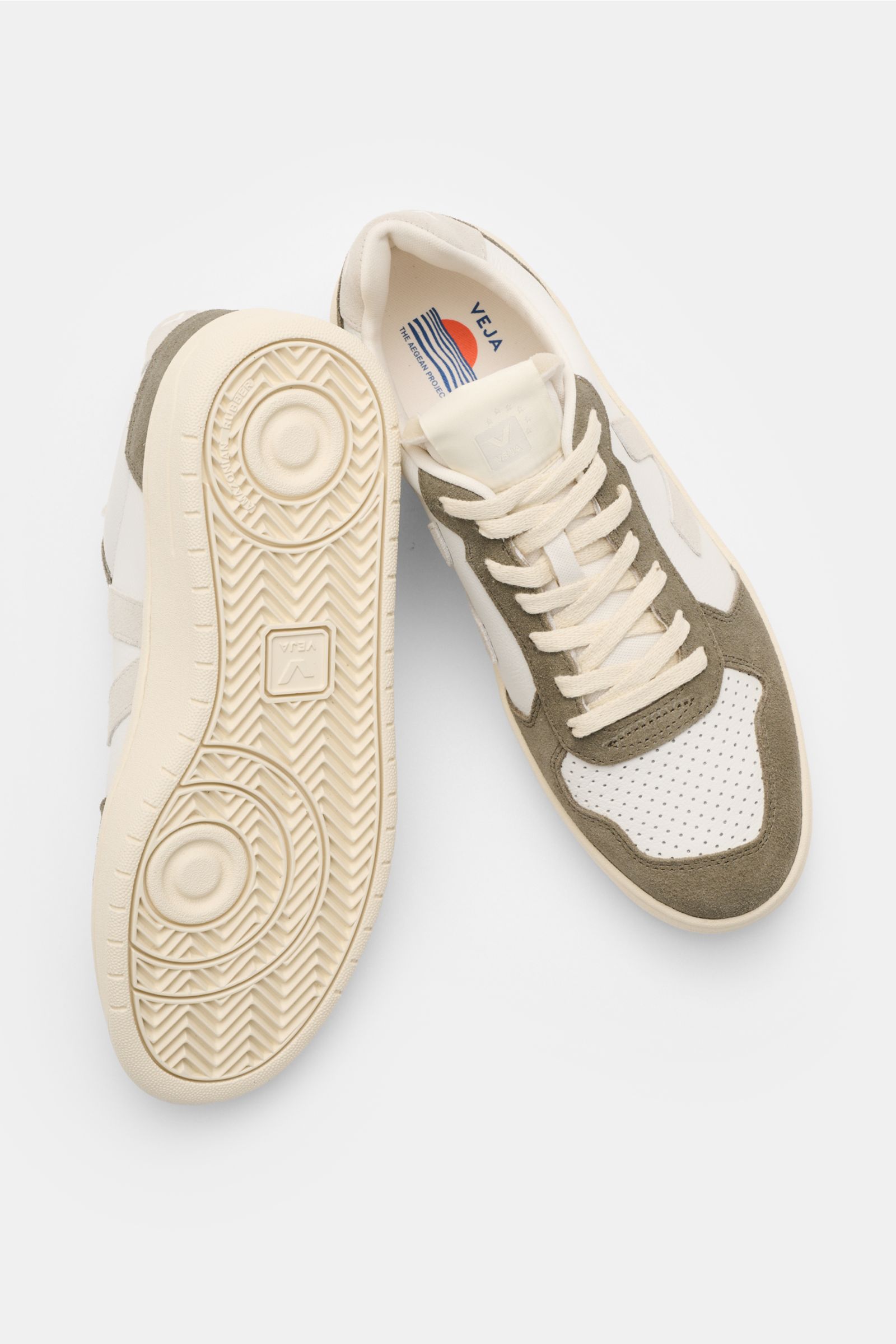Veja Sneaker 'V-82' offwhite/taupe/hellgrau shown from top and sole view, featuring sustainable leather, perforated round toe, seven-eyelet lacing, padded collar with logo, suede overlays, contrasting V-overlay, jersey lining, and recycled rubber sole. 