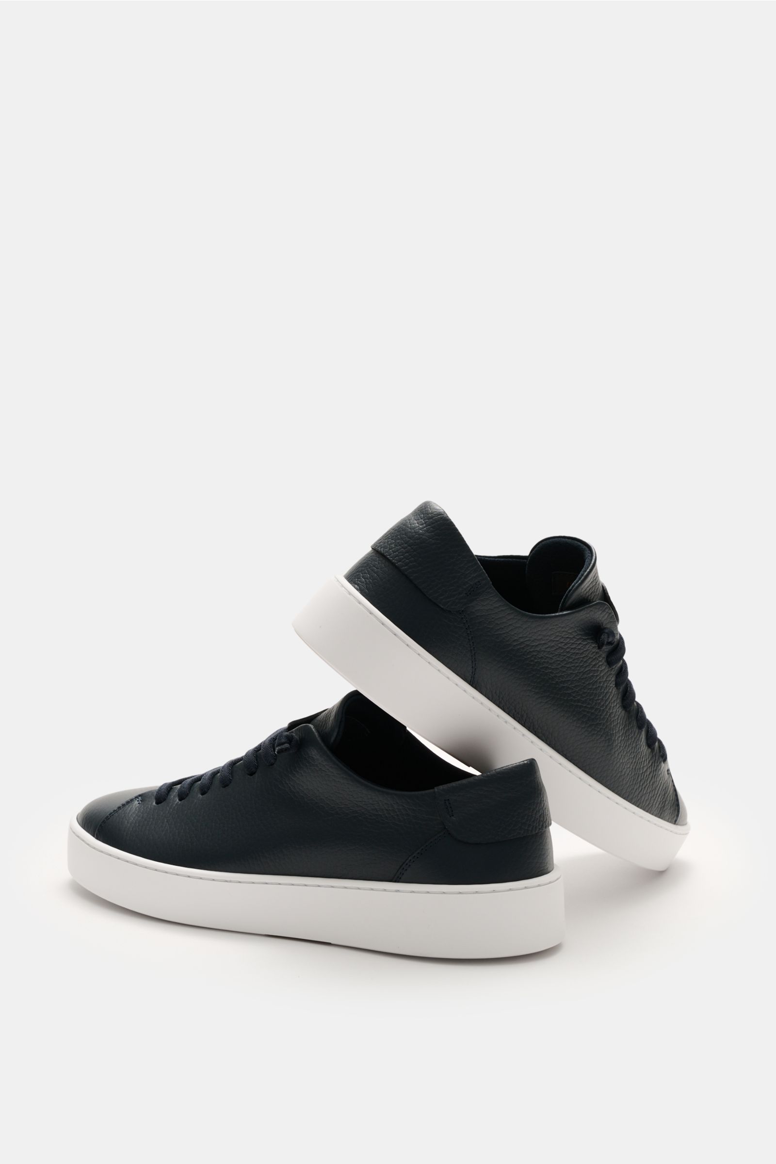 Side view of Fabiano Ricci Sneaker navy made of soft, grained leather with round toe, seven-hole elastic lacing for slip-on effect, logo-embossed tongue, mesh lining, removable padded insole, and flexible white rubber sole.