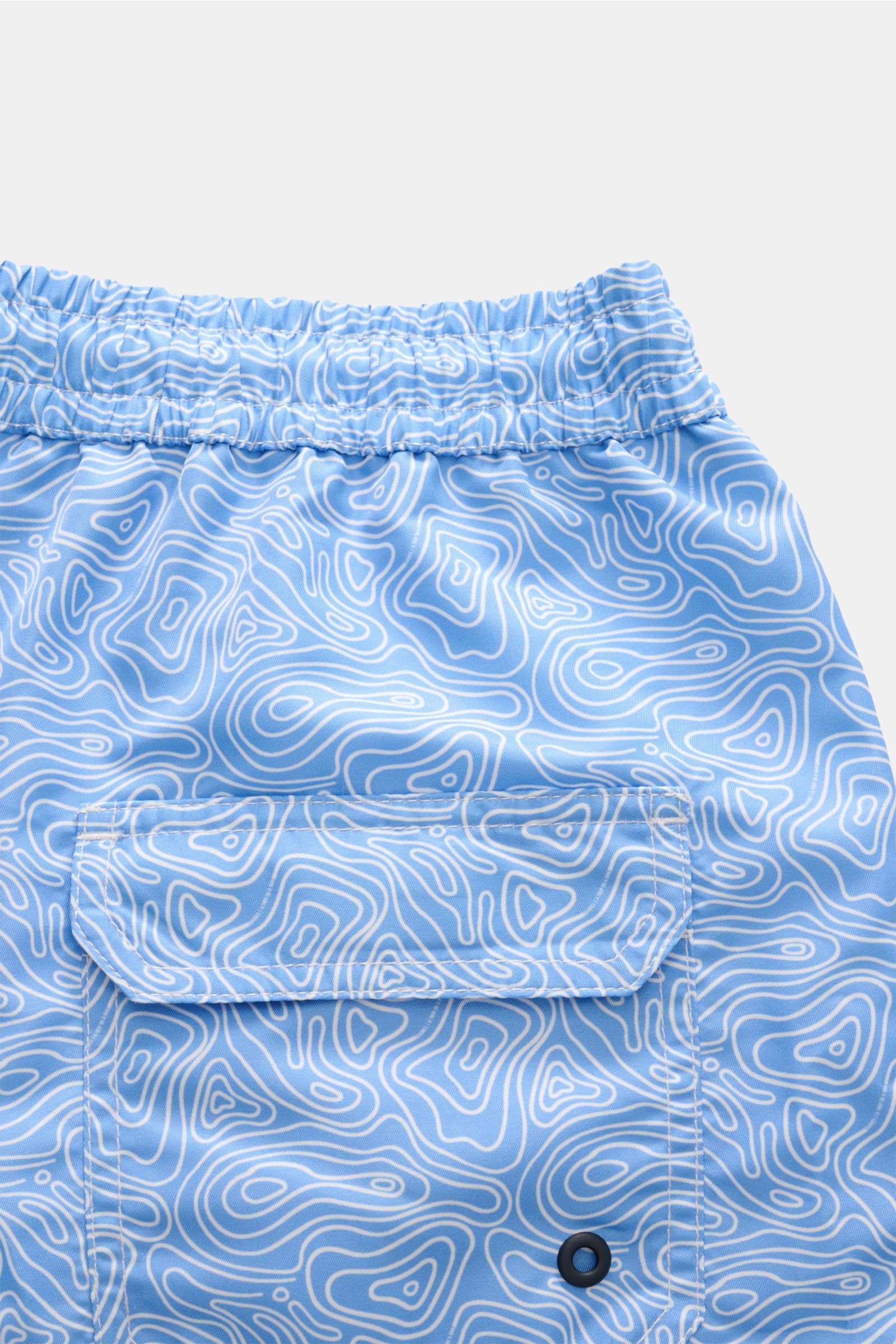 Close-up rear view of 04651/ A trip in a bag Badeshorts 'Seamap' blau/weiß gemustert showing elastic waistband, flap pocket with mesh lining, quick-dry microfiber, and contour line pattern.