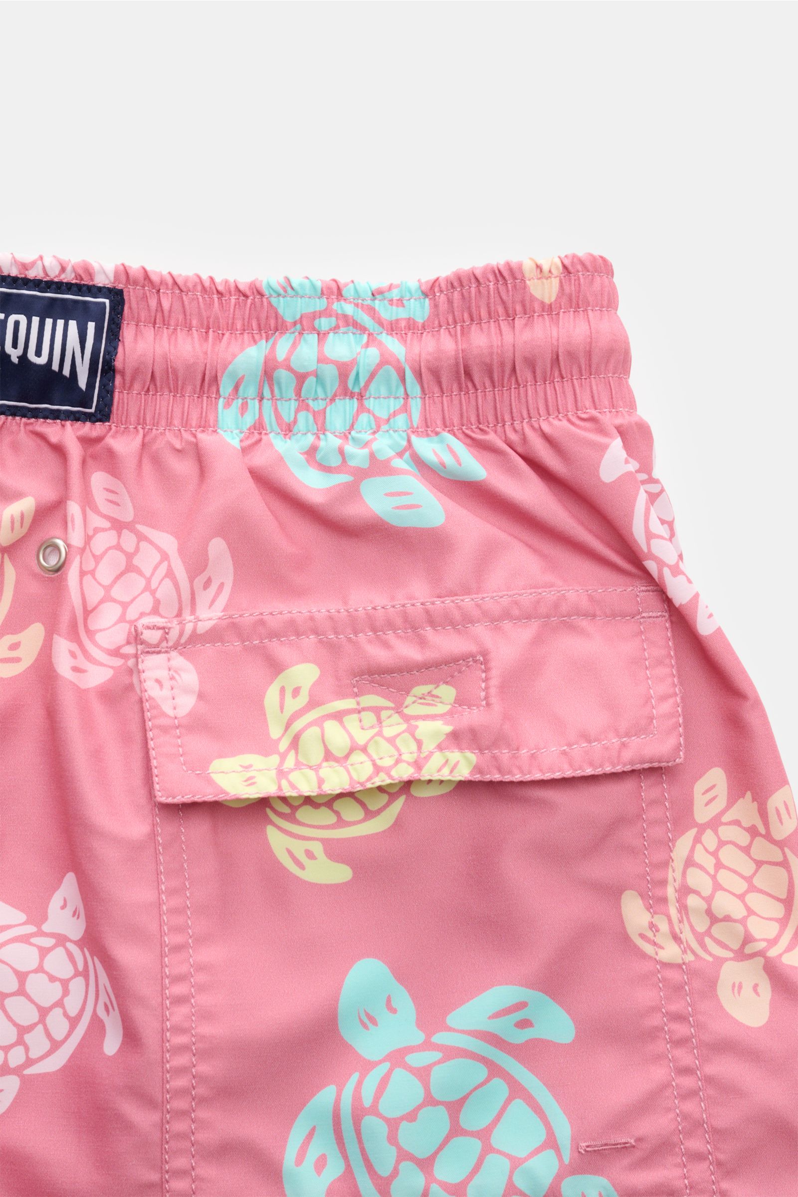 Vilebrequin Swim shorts 'Moorea' rose/mint/yellow patterned shown from a close-up rear perspective, featuring an elasticated waistband with drawstring, side and back pockets with hook-and-loop fastener, drainage eyelets, and VILEBREQUIN woven label on hig