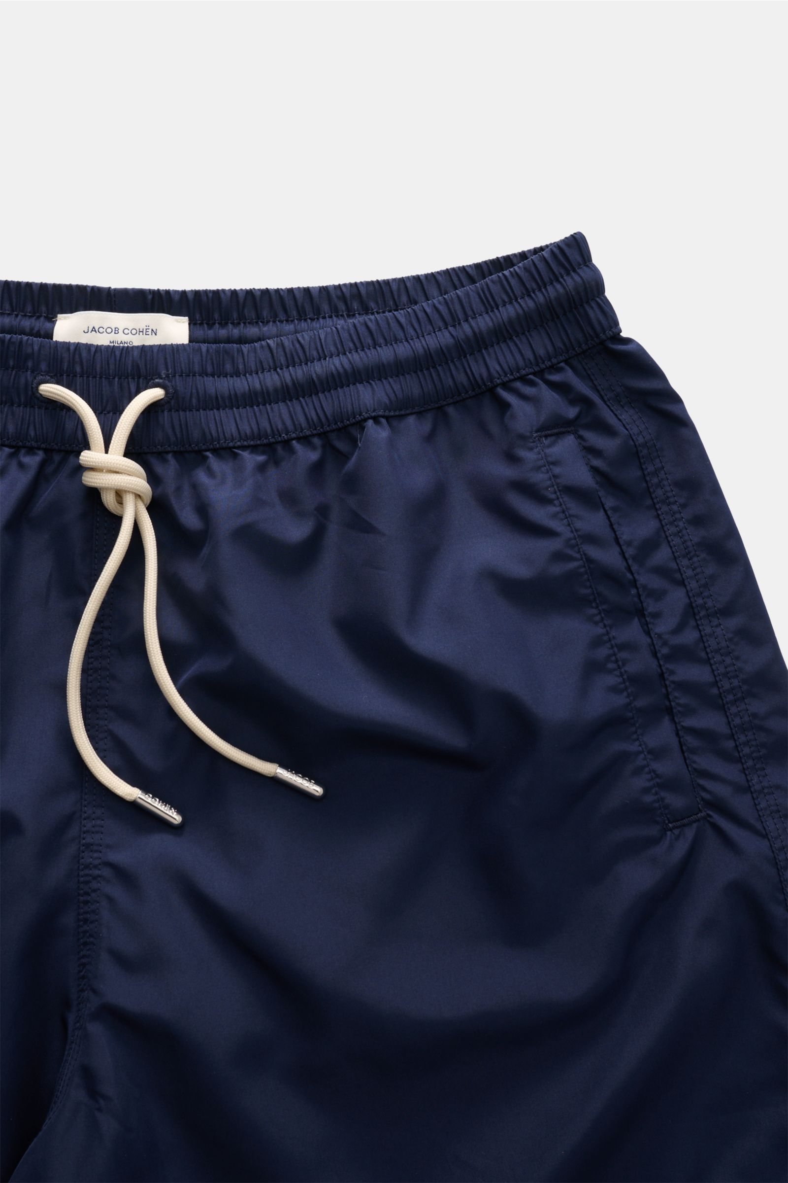 Close-up front view of Jacob Cohen Swim shorts navy in lightweight high-quality microfibre with elasticated waistband and drawstring.

Description: Lightweight in your luggage: These swim shorts from JACOB COHEN, made from lightweight, high-quality microf