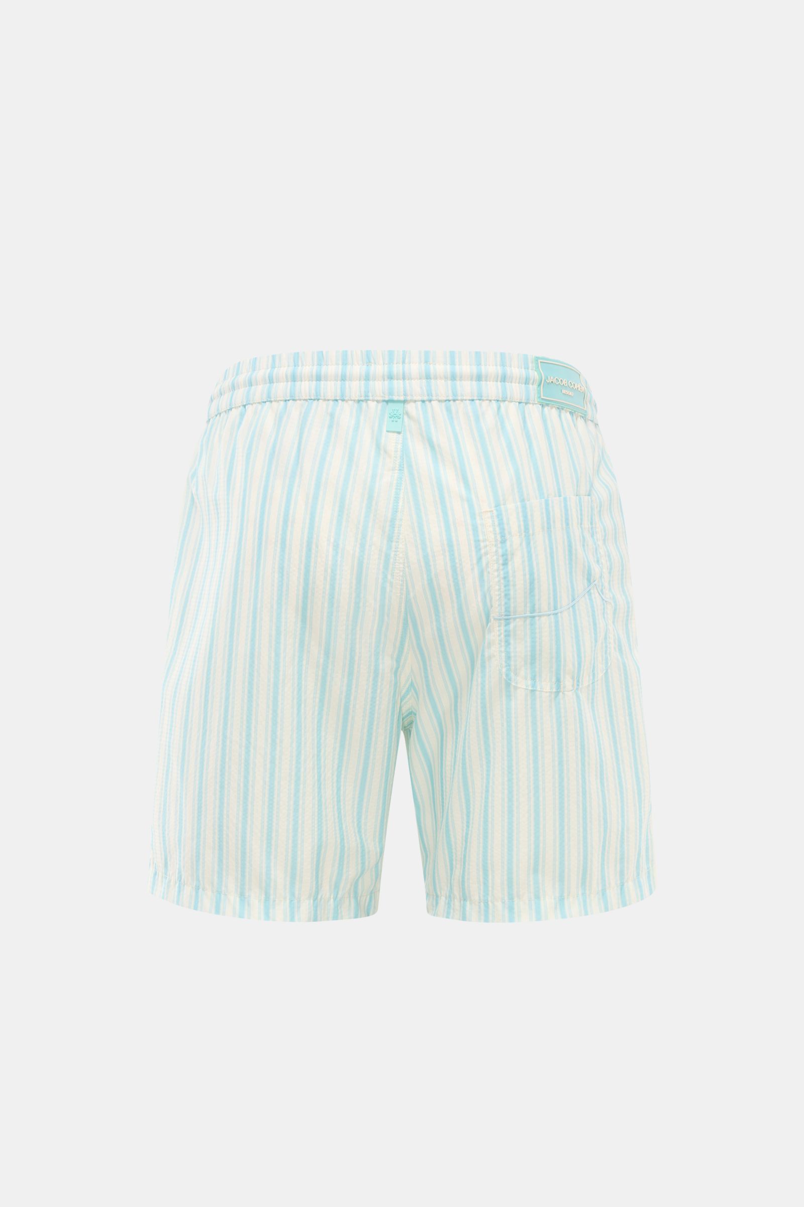 Rear view of Jacob Cohen Swim shorts light blue/white striped with elasticated waistband, patch back pocket, and classic striped pattern.

Description:  
Perfect for sunny days: These swim shorts by JACOB COHEN combine flowing material with a classic s