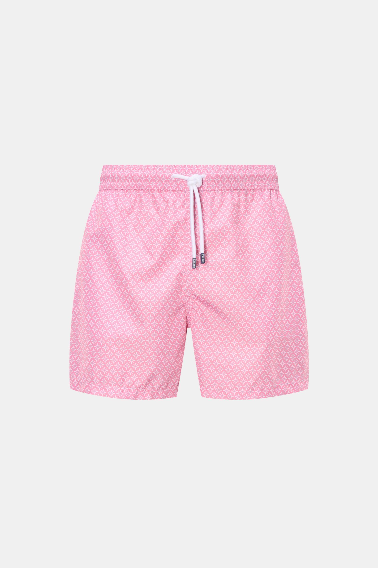 Front view of Fedeli Swim shorts 'Madeira Airstop' rose/white patterned with elasticated waistband, drawstring, and floral pattern, made of quick-drying recycled microfiber. An essential for your summer vacation: These FEDELI swim shorts have an expressiv