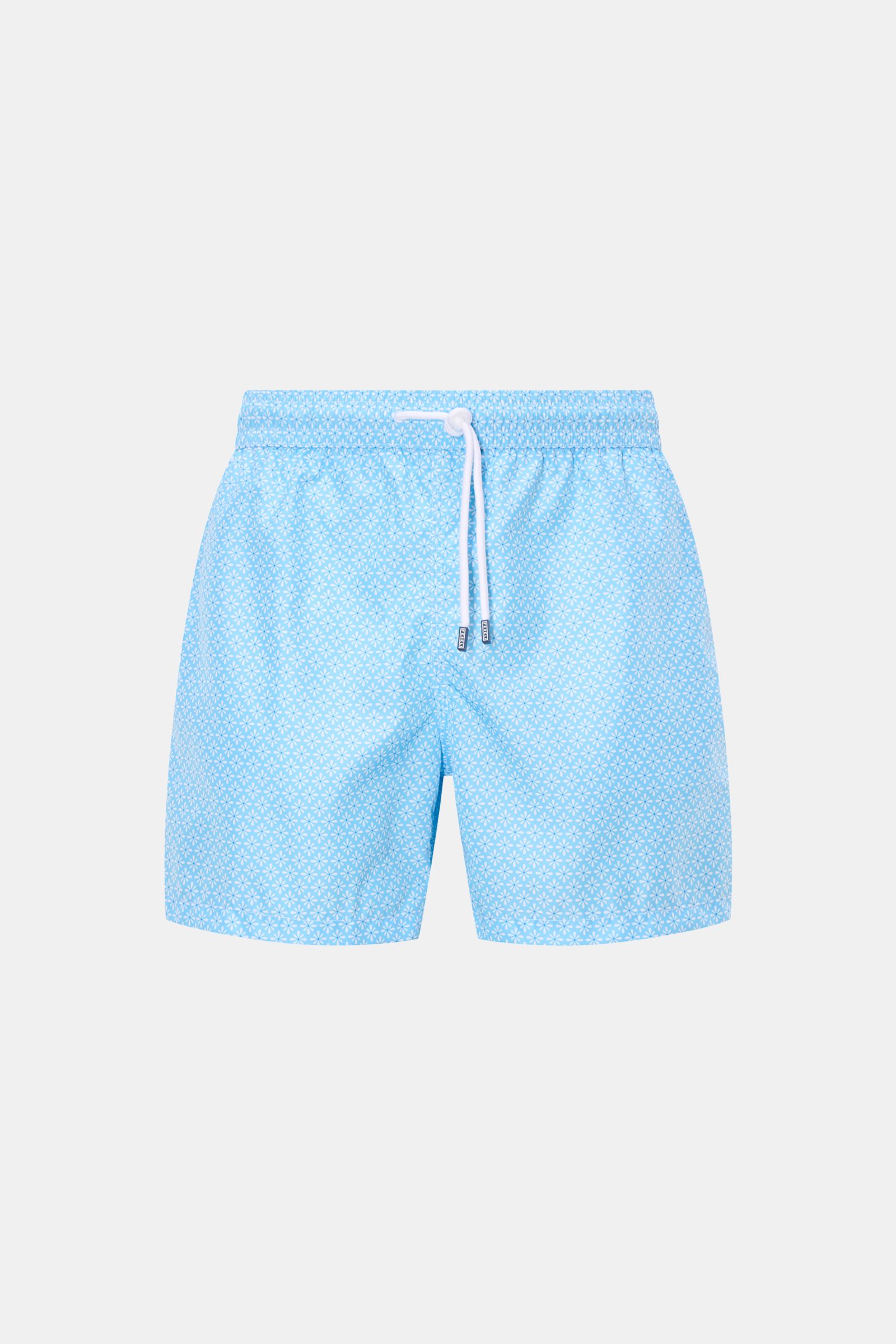 Front view of Fedeli Swim shorts 'Madeira Airstop' light blue/white patterned with elastic waistband, drawstring, and floral pattern.

Description: An essential for your summer vacation: These FEDELI swim shorts have an expressive pattern that adds stylis