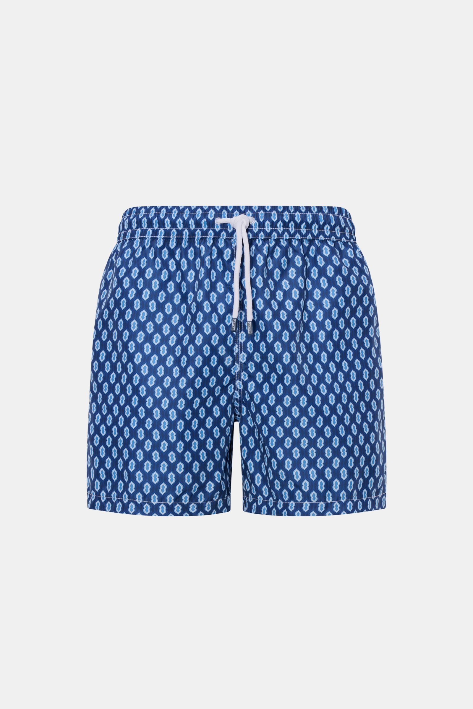 Front view of Fedeli Swim shorts 'Madeira Airstop' dark blue/blue/white patterned with elasticated waistband and white drawstring.

An essential for your summer vacation: These FEDELI swim shorts have an expressive pattern that adds stylish accents and