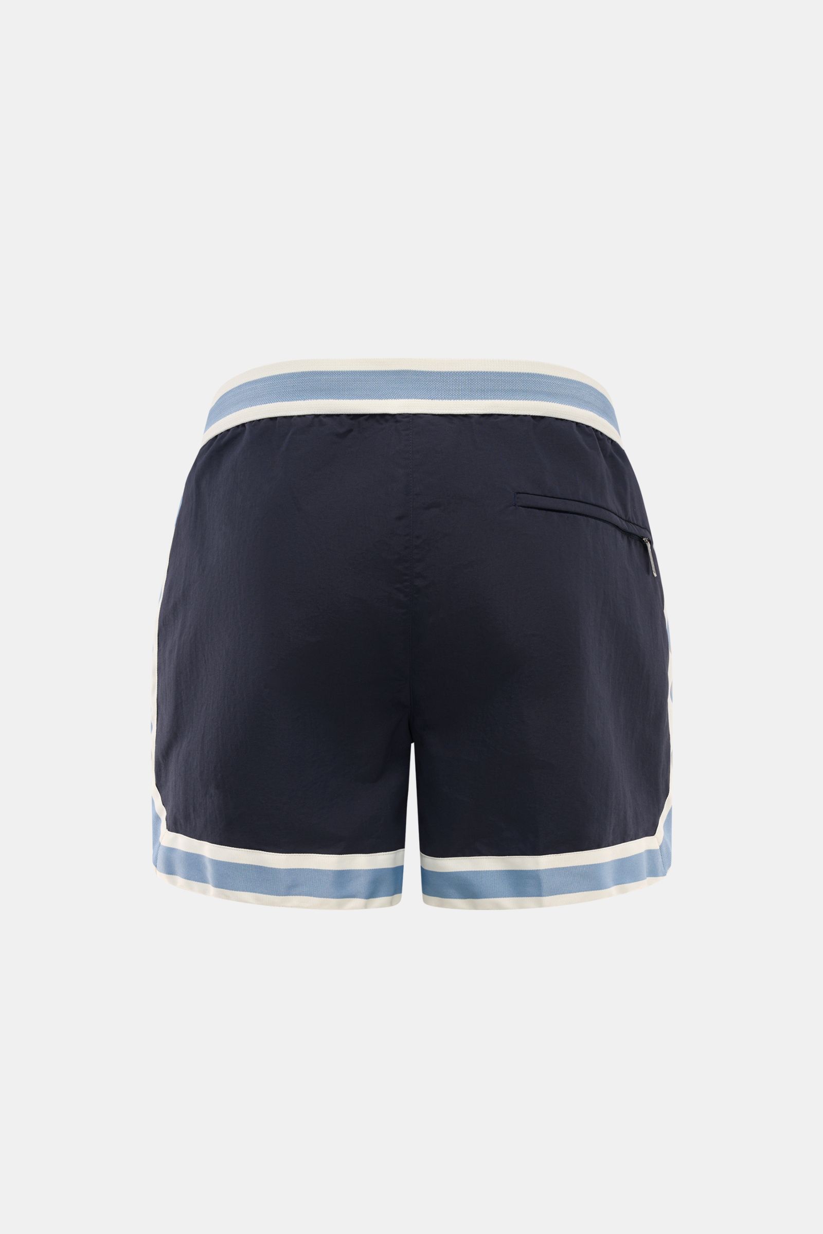 Ché Swim shorts 'Baller' navy shown from the back, featuring a retro short cut with elasticated waistband, zip and snap button, and zippered back pocket. 

The swim shorts 'Baller' by CHÉ give summery vibes and have a short cut in a retro design that m