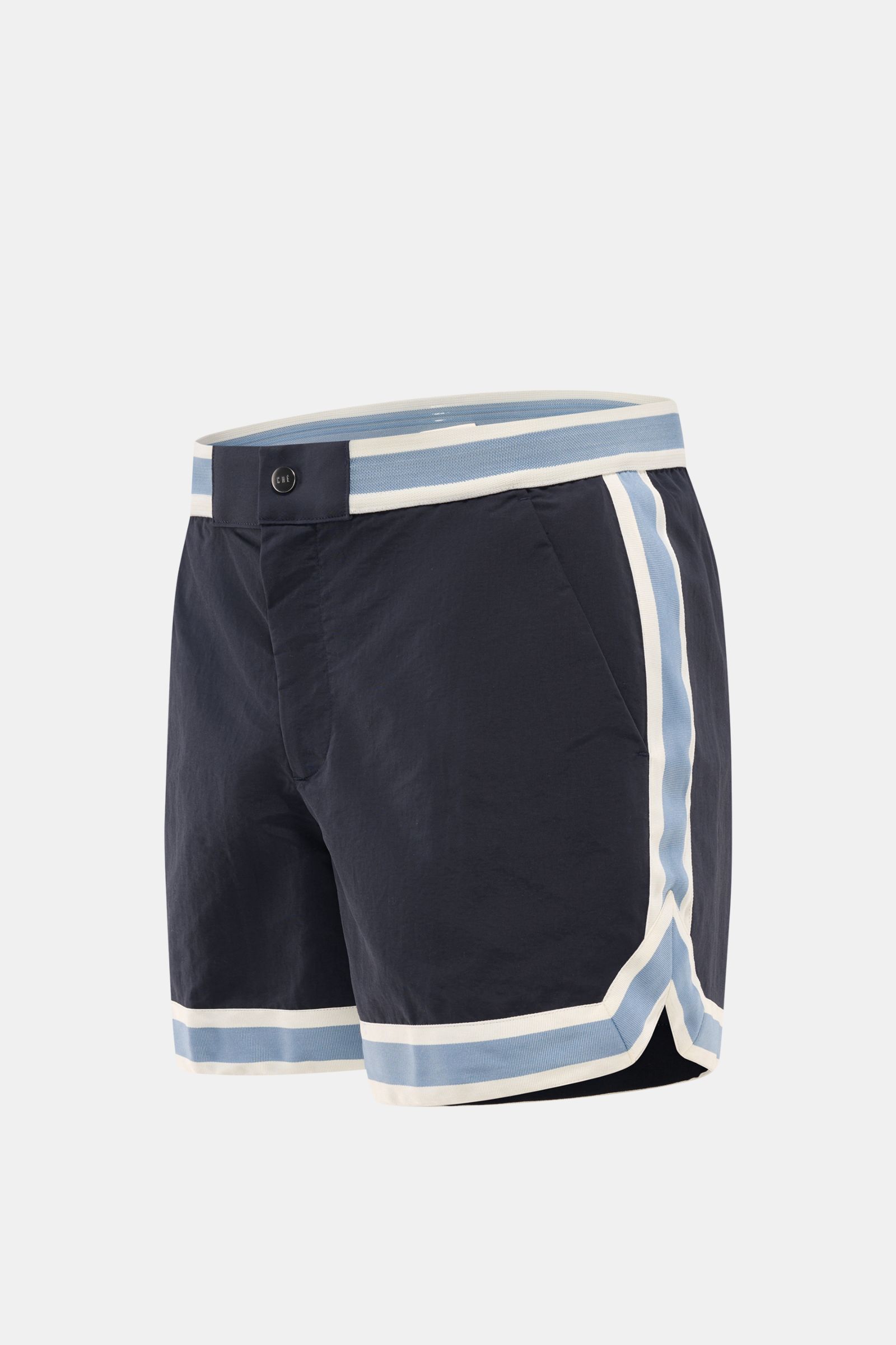 Front side view of Ché Swim shorts 'Baller' navy with light blue and white grosgrain trim and elasticated waistband.

The swim shorts 'Baller' by CHÉ give summery vibes and have a short cut in a retro design that makes them a must-have for the coming b
