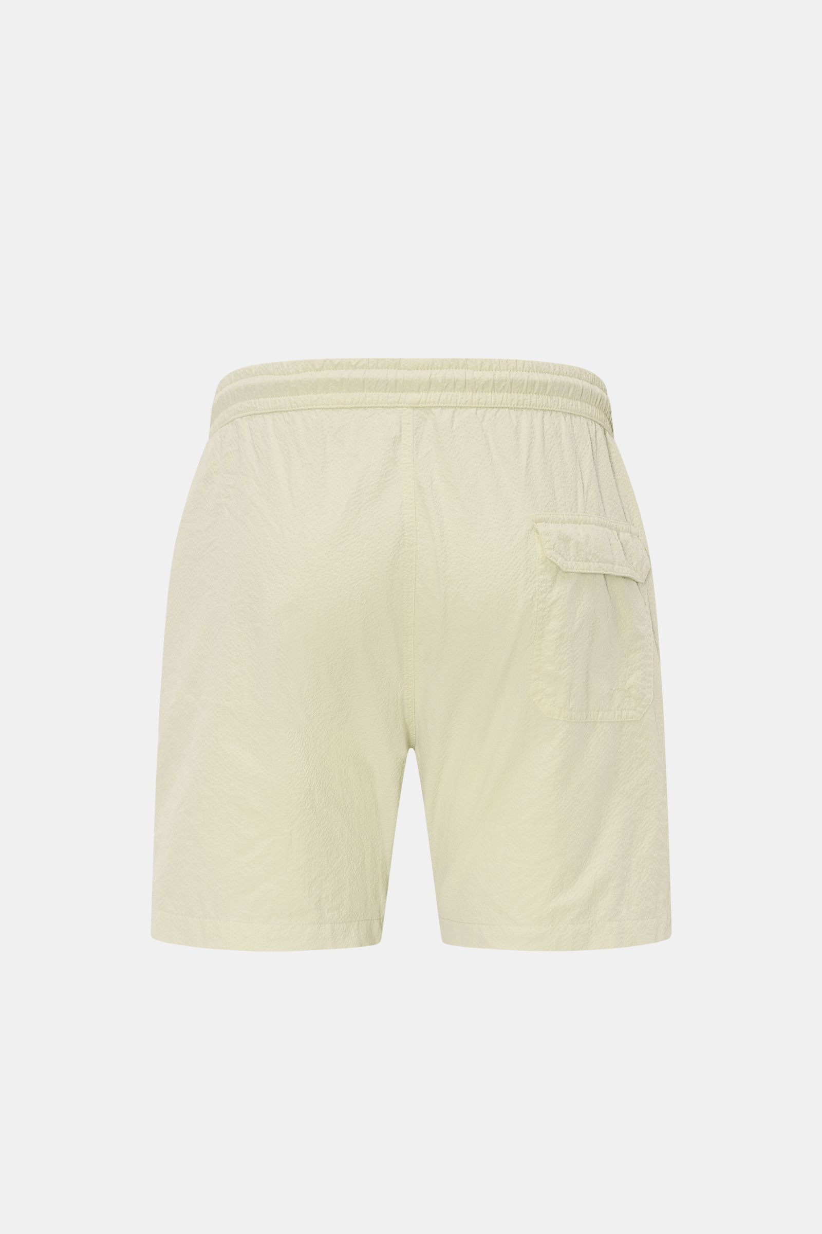 Rückansicht der 04651/ A trip in a bag Badeshorts 'Mono Seersucker' salbei aus leichtem Seersucker-Microfaserstoff mit elastischem Bund, Gesäßtasche und Saumschlitzen.