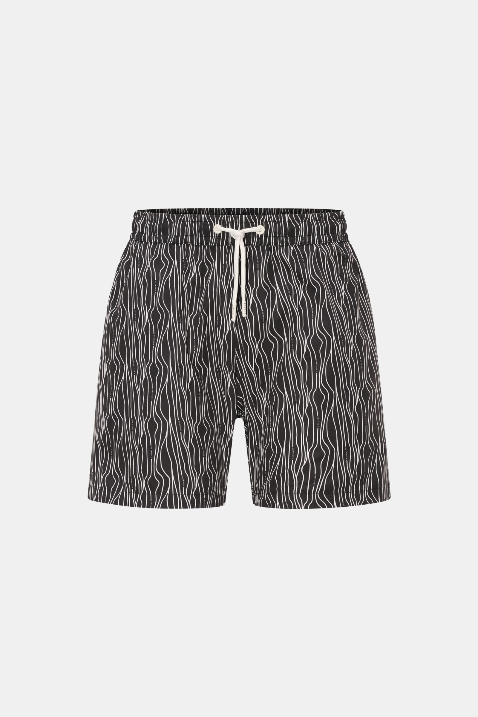 Front view of 04651/ A trip in a bag Swim shorts 'Superkilen' black/white patterned with wavy all-over print, elasticated waistband, and drawstring.

Description: An eye-catching piece for summer: With their all-over print inspired by Copenhagen’s 'Sup