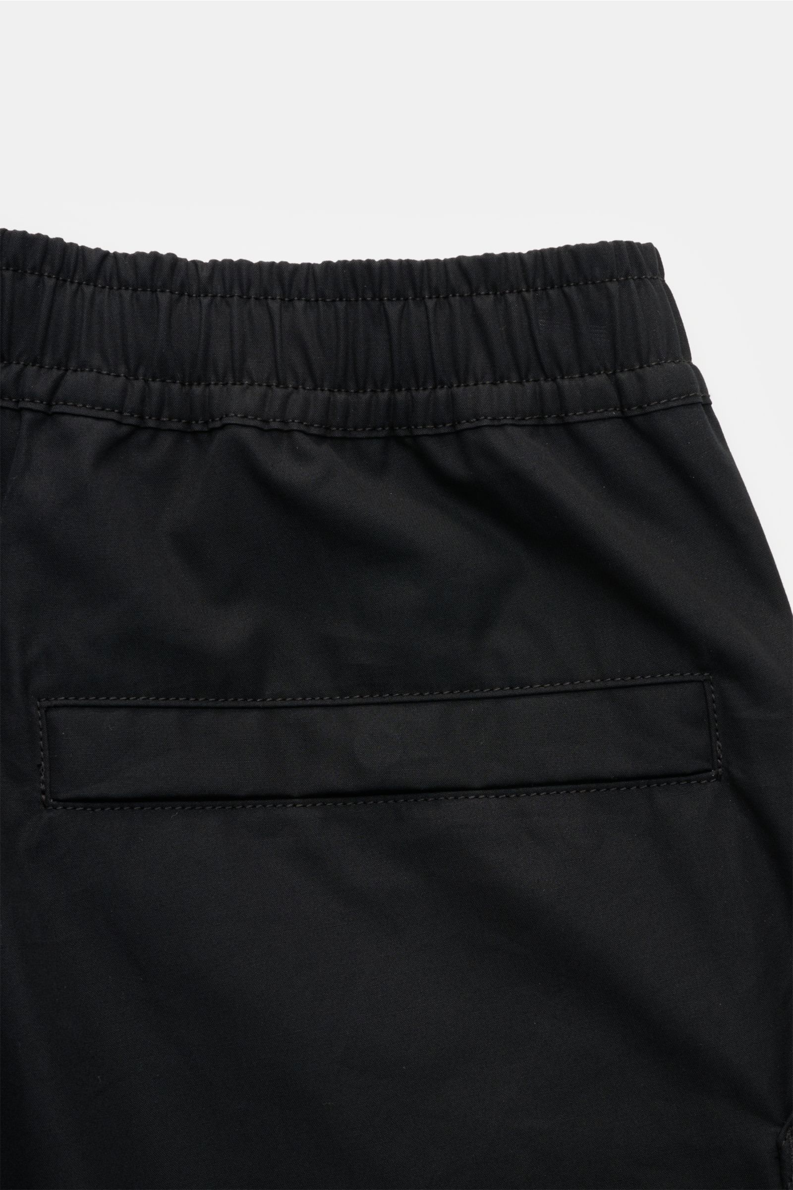 Close-up rear view of Stone Island Shorts 'Ghost' black showing elasticated waistband and jetted back pocket in pure cotton fabric.

Modern utility design: These STONE ISLAND shorts from the 'Ghost' Capsule Collection are timelessly understated in high