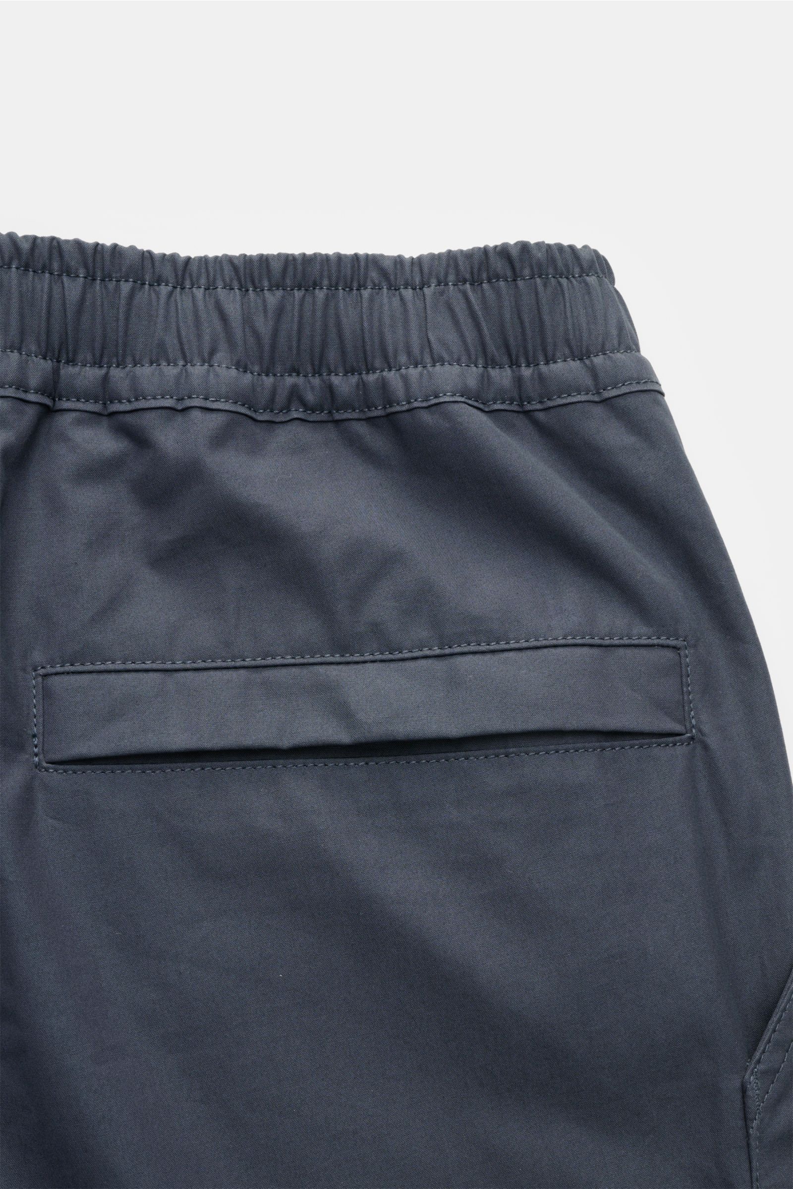 Alt tag (125 characters max): Close-up rear view of Stone Island Shorts 'Ghost' grey-blue with elastic waistband and jetted back pocket in soft cotton.

Description:
Modern utility design: These STONE ISLAND shorts from the 'Ghost' Capsule Collection a