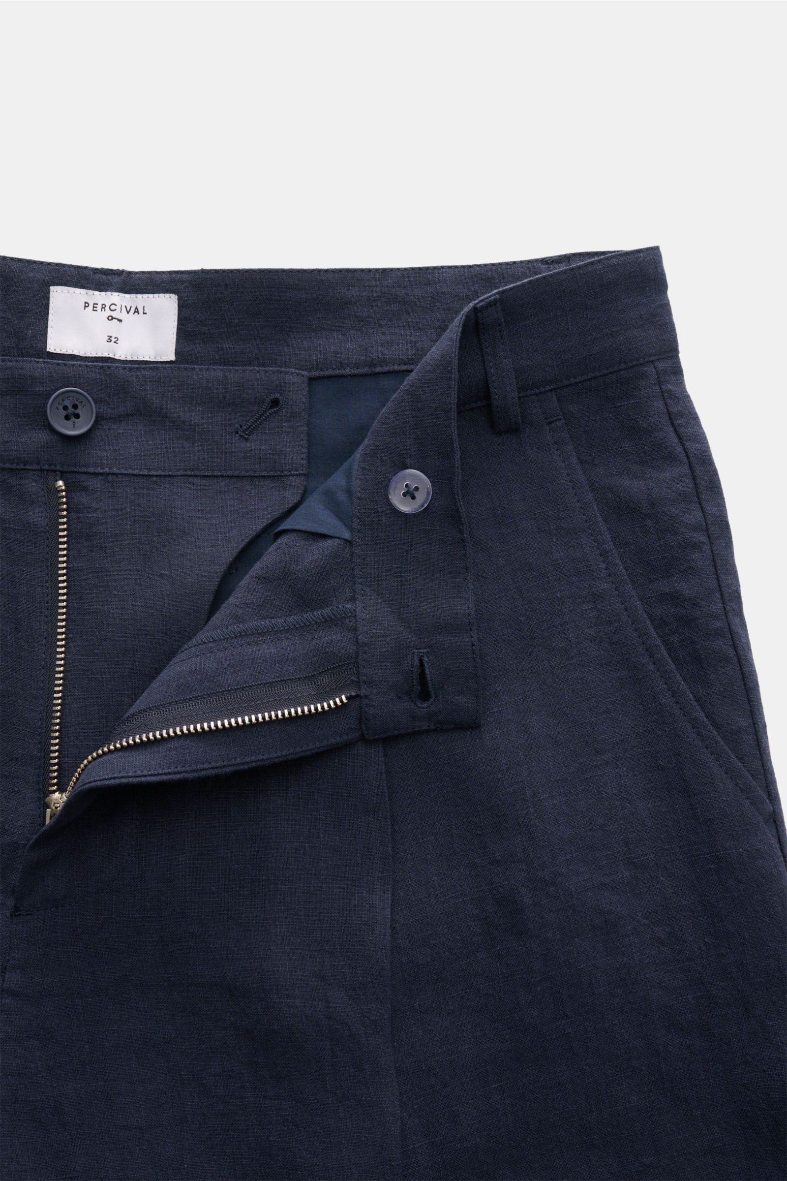 Alt tag (125 characters max):  
Close-up front view of Percival Linen shorts navy with open zipper, button, and visible linen texture.

Additional description:  
Stay smart this summer: These shorts made of pure, airy linen by London label PERCIVAL is 