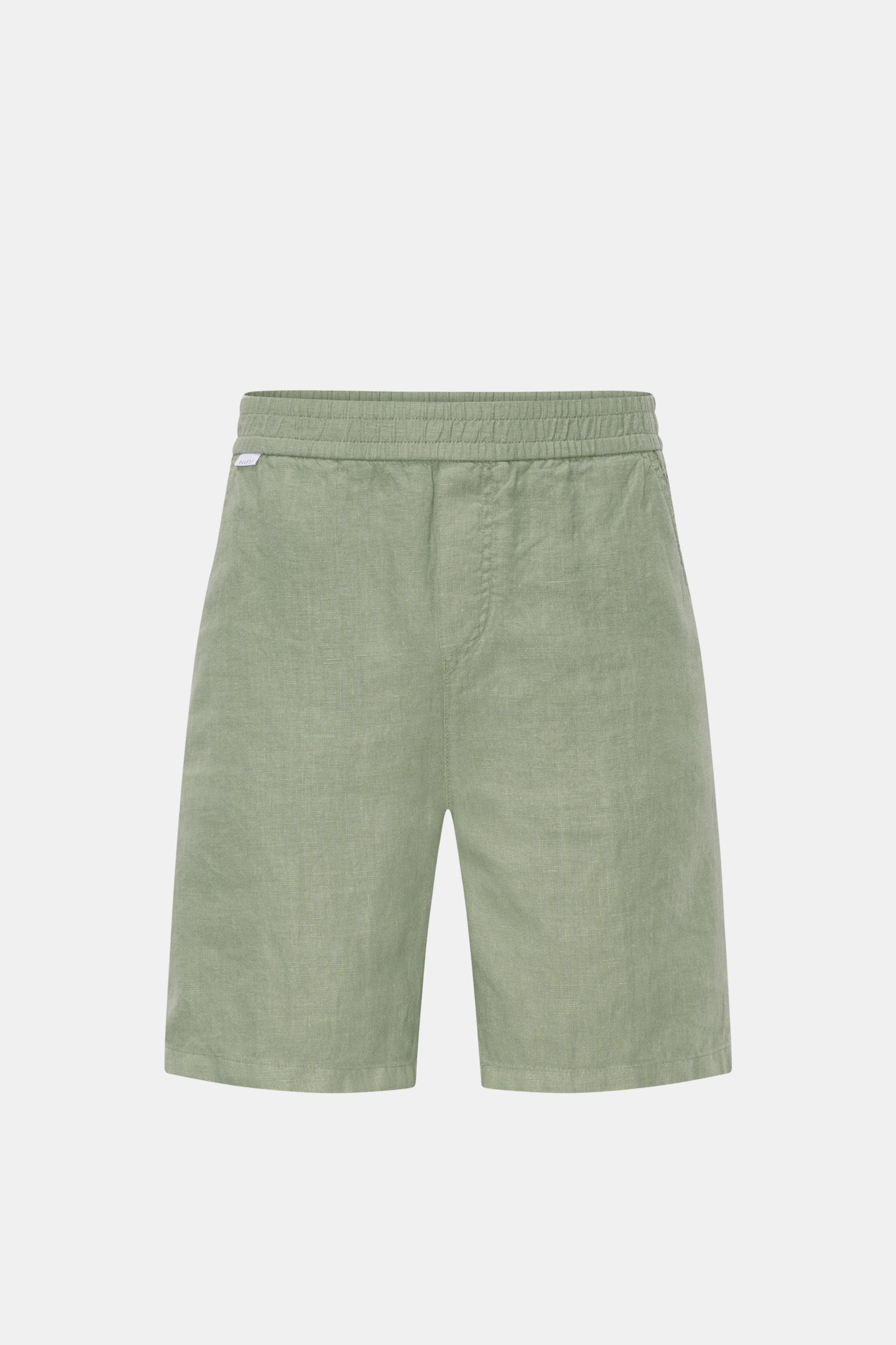 Front view of 04651/ A trip in a bag Linen shorts sage in soft, airy garment-dyed linen with elastic waistband, French pockets, patch back pocket, and small woven label.

Description: With this airy model, 04651/ A TRIP IN A BAG presents a comfortable 