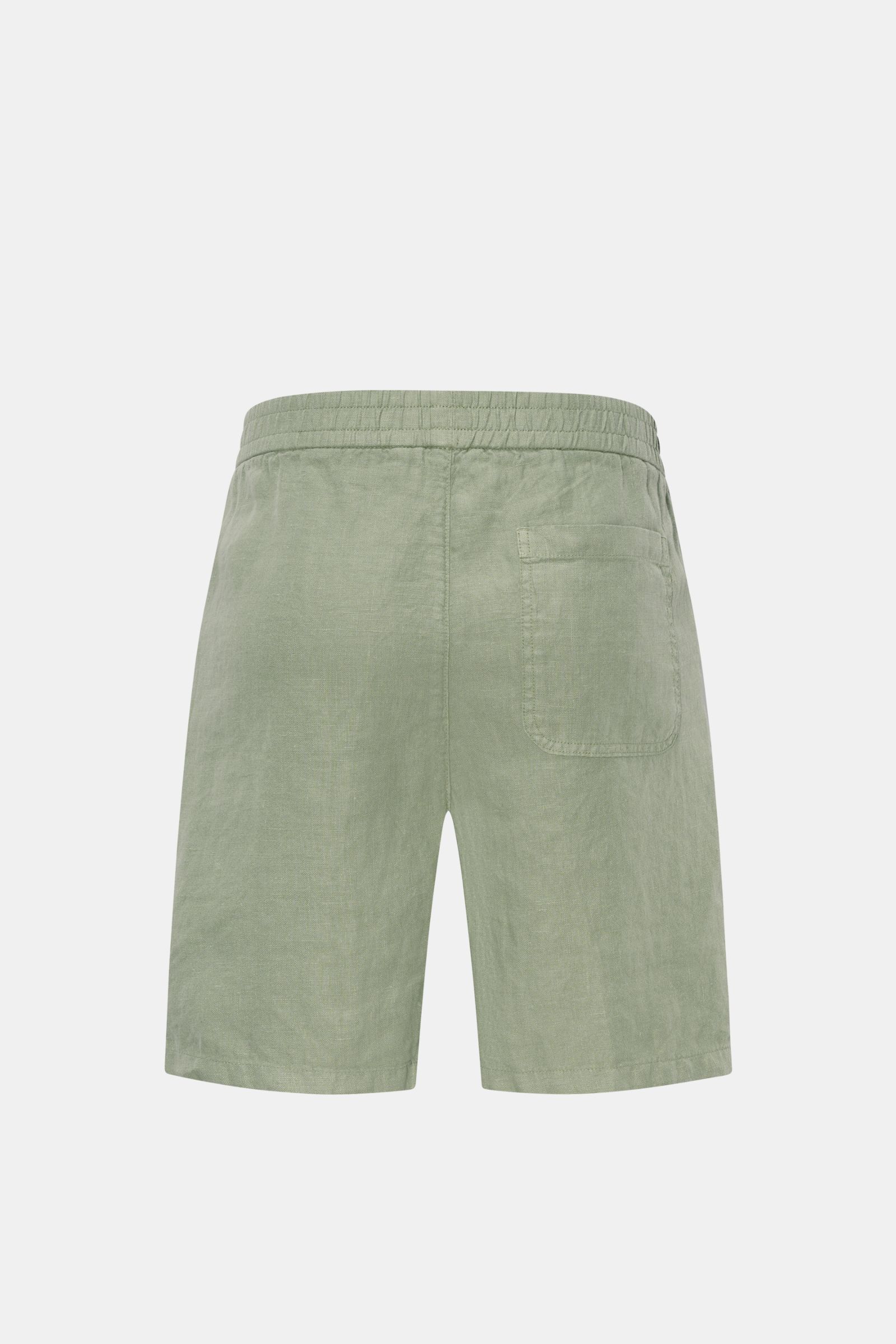 Rear view of 04651/ A trip in a bag Linen shorts sage in soft, garment-dyed airy linen with elastic waistband, French and patch pockets.

Description: With this airy model, 04651/ A TRIP IN A BAG presents a comfortable pair of pure linen shorts that ar