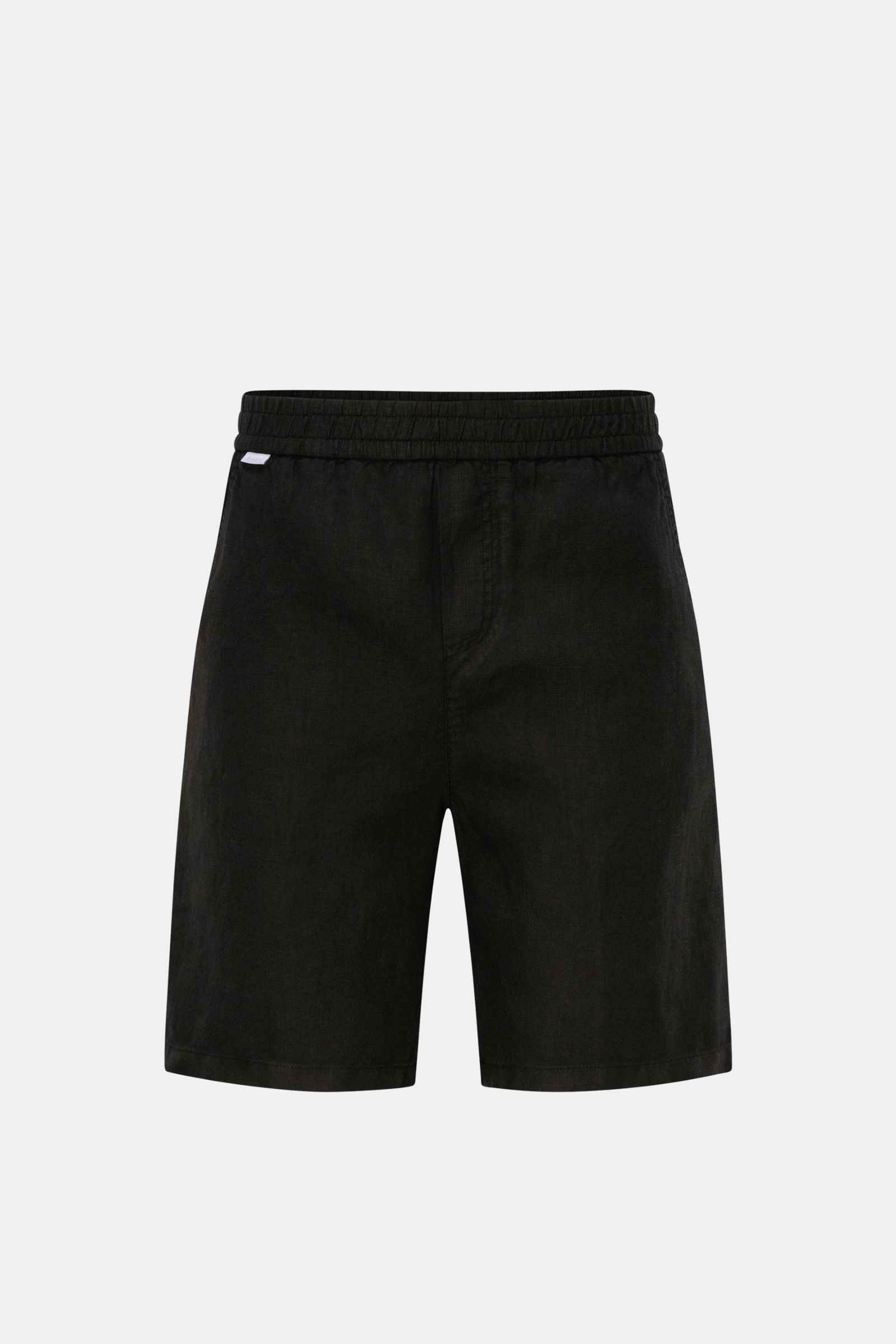 Front view of 04651/ A trip in a bag Linen shorts black, made of airy linen fabric with elastic waistband, French pockets, and patch back pocket.

Description: With this airy model, 04651/ A TRIP IN A BAG presents a comfortable pair of pure linen short