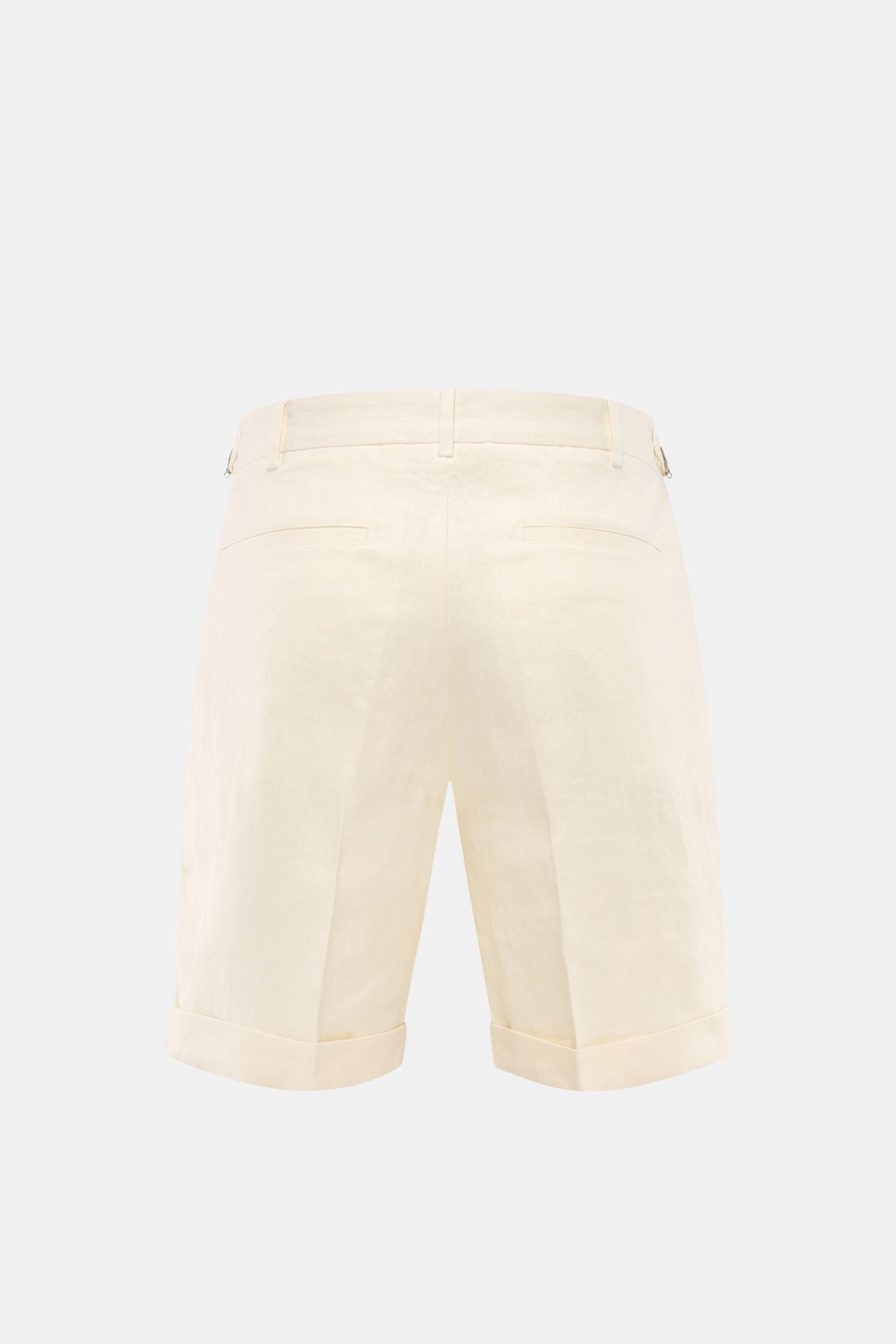 Rear view of 04651/ A trip in a bag Linen shorts cream in pure linen with double pleats, side adjusters, French and hip pockets, fixed hem turn-up.

Description: Perfect for warm days: These linen shorts by 04651/ A TRIP IN A BAG are the ideal summer e