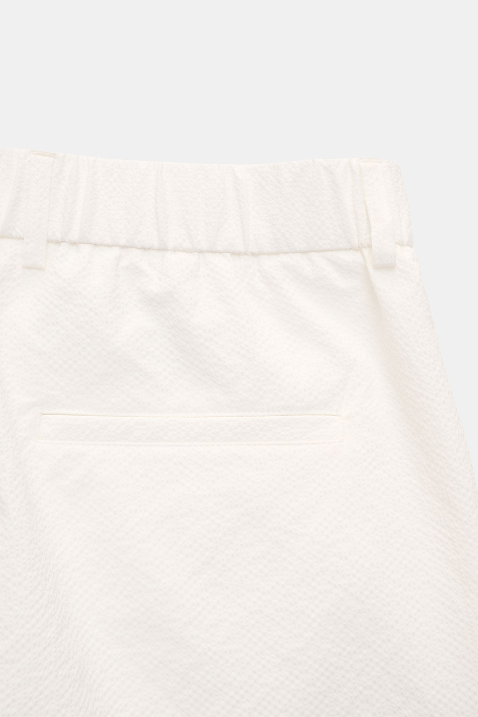 Close-up rear view of 04651/ A trip in a bag Seersucker shorts white, showing seersucker microfibre texture, elasticated waistband, hip pockets, and fixed hem turn-up. 

Description: With this classic model, 04651/ A TRIP IN A BAG presents a comfortable p