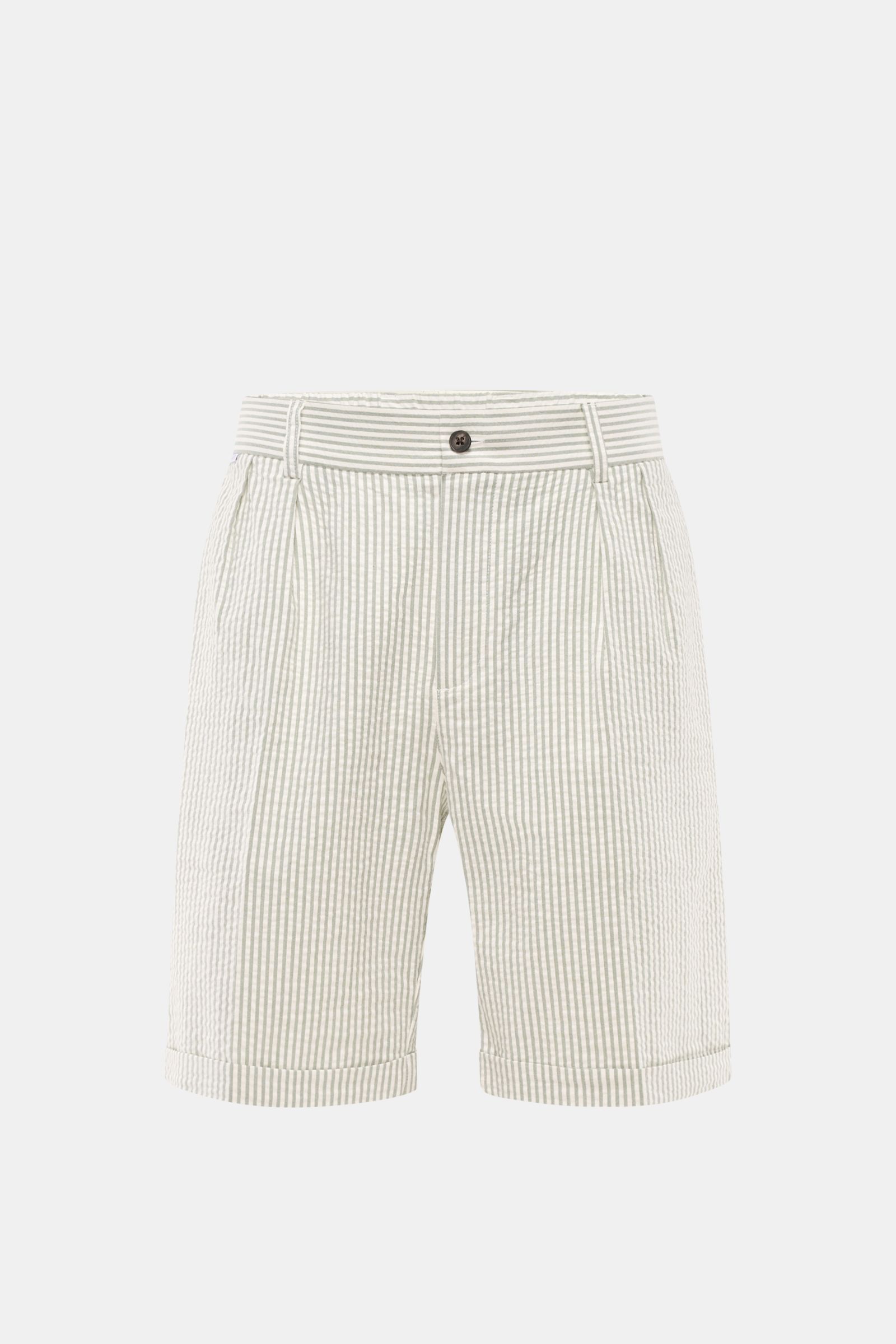 Front view of 04651/ A trip in a bag Seersucker shorts sage/off-white striped, cotton seersucker with double pleats, French and hip pockets, partially elasticated waistband, regular fit, and fixed hem turn-up.

Description: 
Perfect for your next summe
