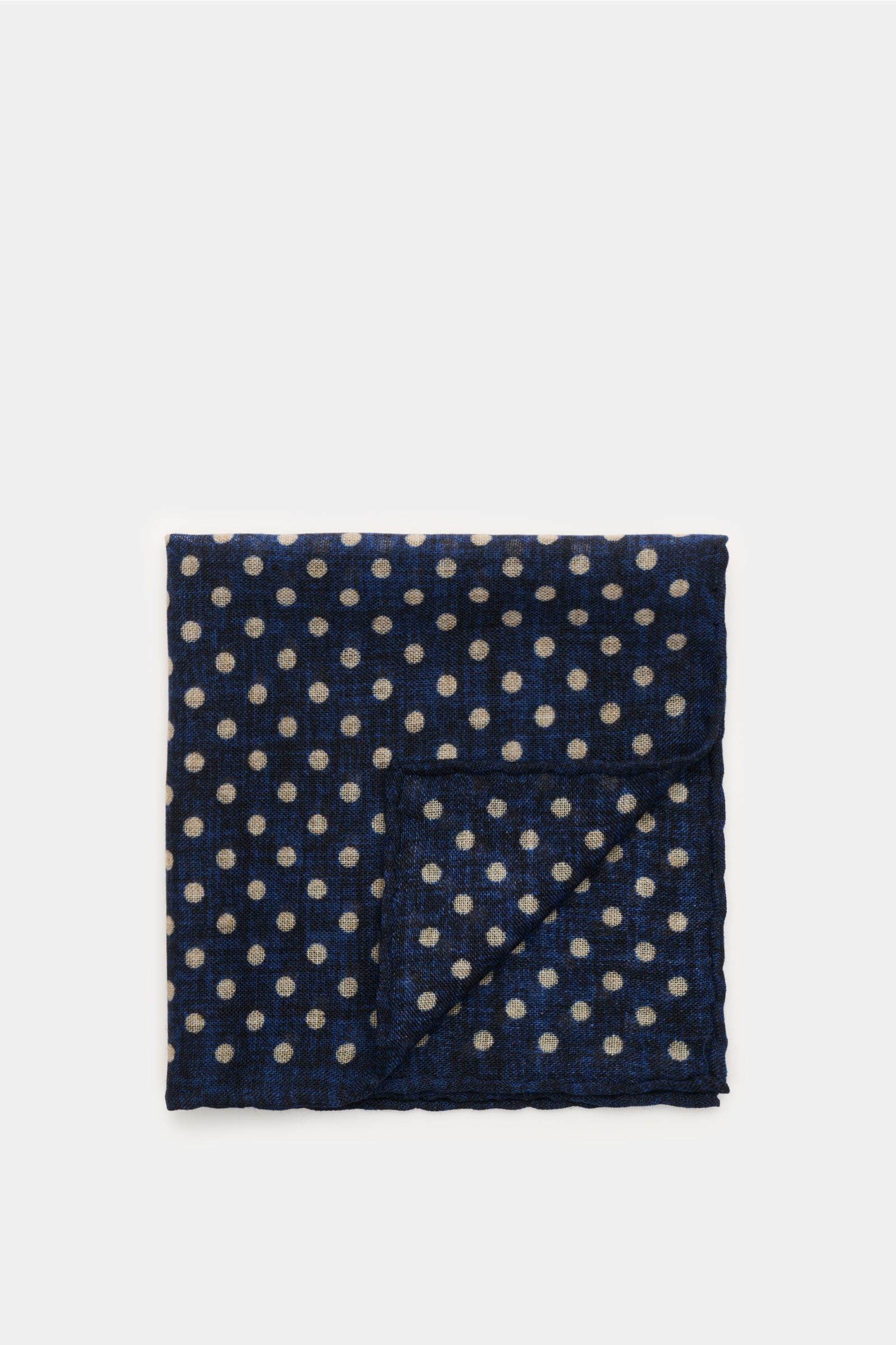 Rosi Collection Pocket square navy/beige dotted shown from top view, pure wool with soft feel, graphic polka dot pattern, hand-rolled edges, made in Italy, approx. 29 cm x 29 cm.