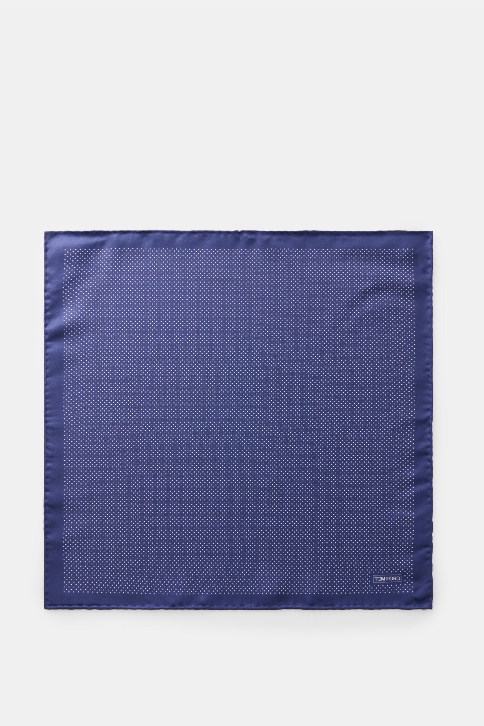 Top-down view of Tom Ford Seiden-Einstecktuch dunkelblau/weiß gepunktet, pure silk pocket square with smooth feel, dotted pattern, rolled edges, and small TOM FORD print, made in Italy, approx. 39x39 cm.