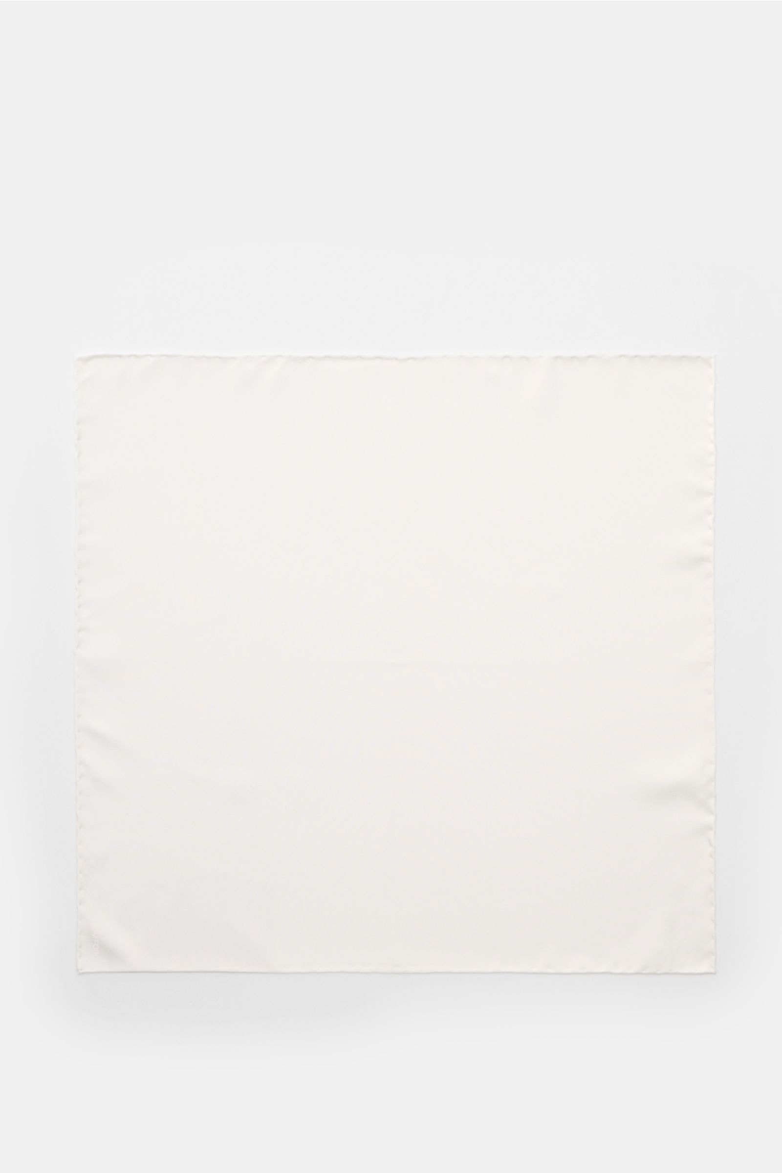 Top-down view of a Tom Ford Silk pocket square white, made of pure silk with rolled edges and a small tonal TOM FORD print, showcasing a smooth feel and approx. 38.5 cm x 38.5 cm dimensions, made in Italy.