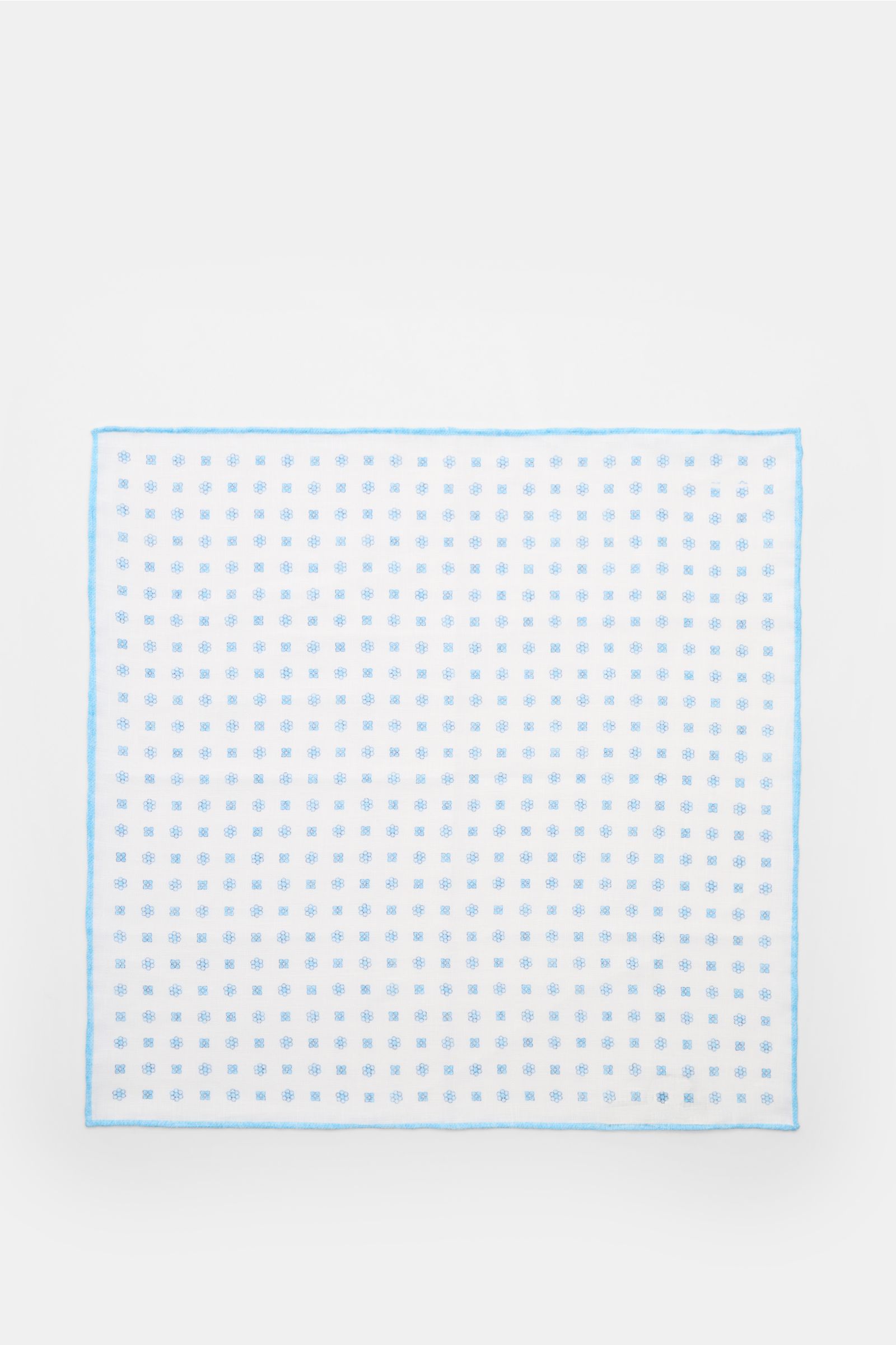 Top-down view of the Rosi Collection Linen pocket square 'Fox' white/light blue patterned, pure linen with soft feel, floral print, rolled edges, made in Italy, dimensions 31.5 cm x 31.5 cm.