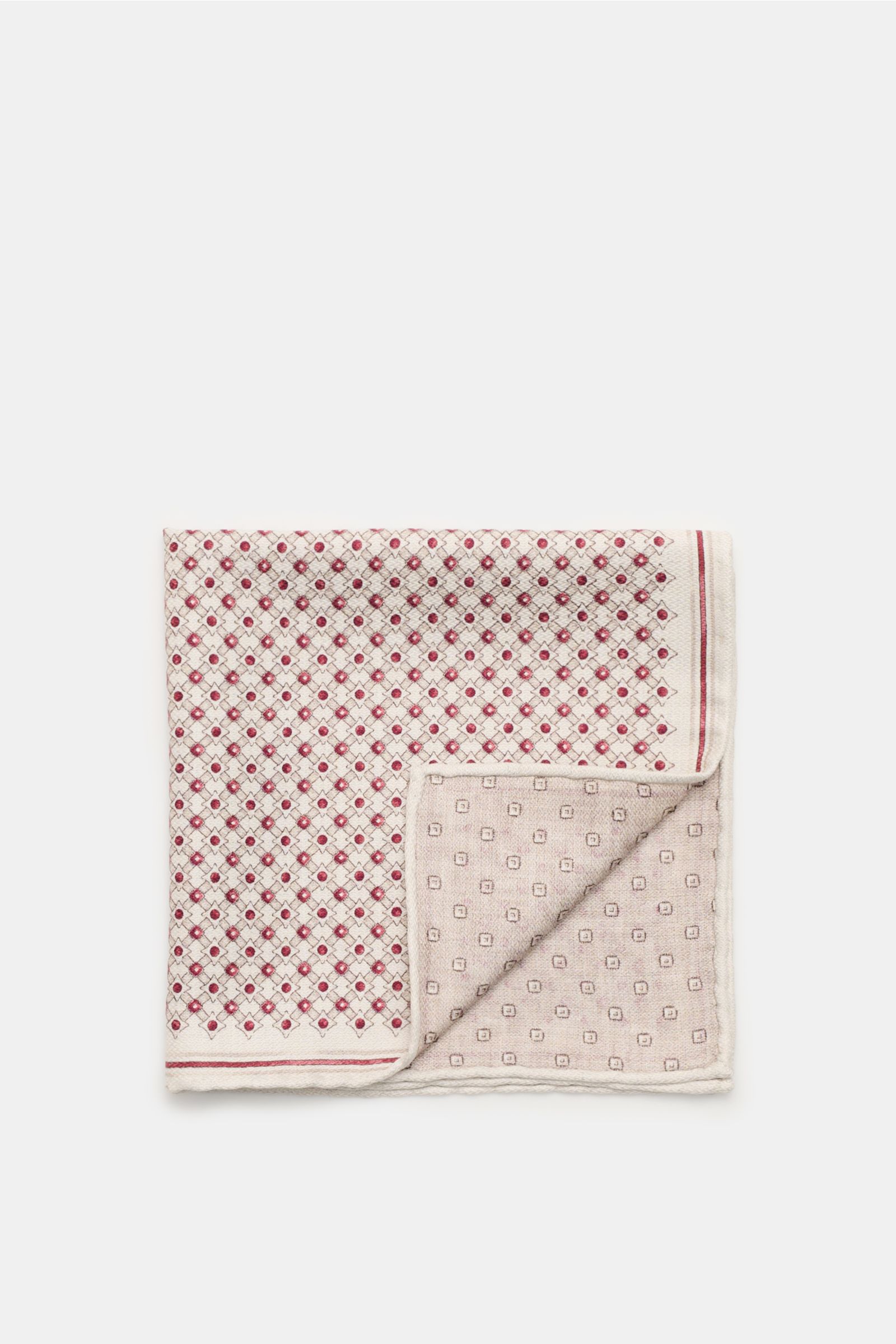Top view of a Brunello Cucinelli Silk pocket square sand/dark red/beige patterned, folded to show different front and back graphic prints with rolled edges.