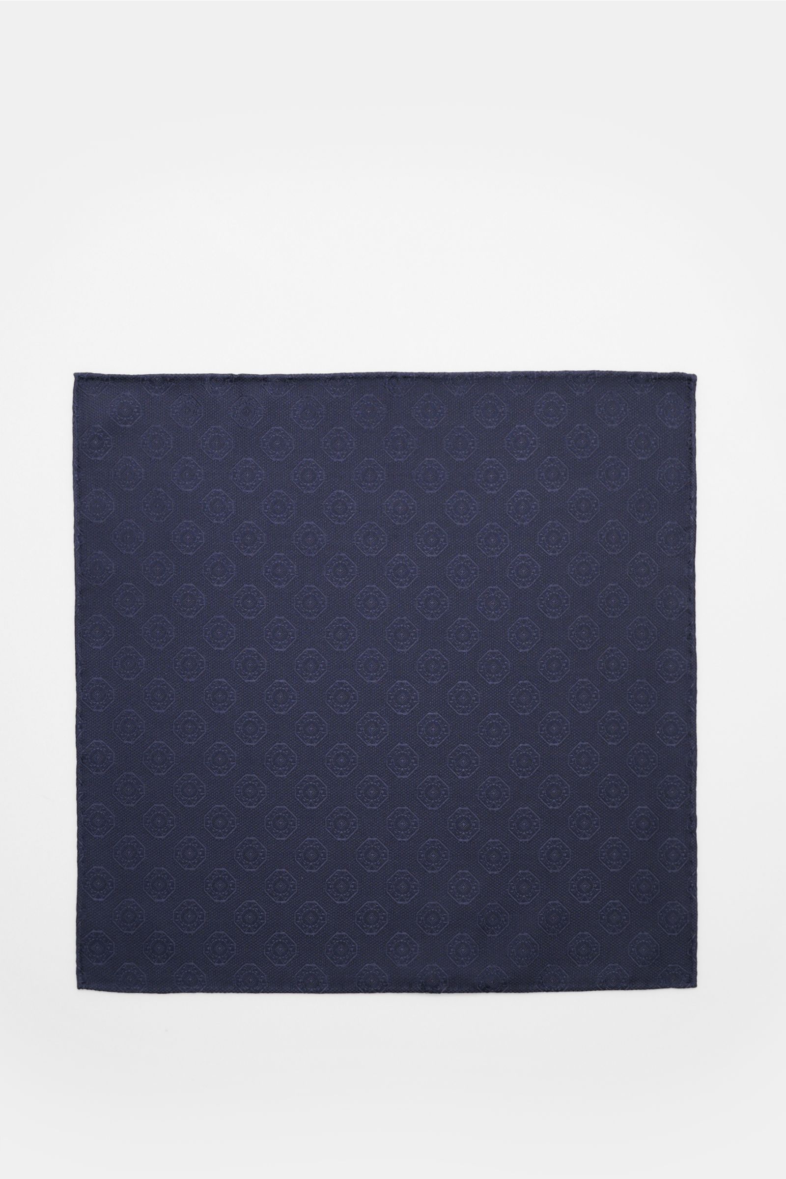 Top-down view of Brunello Cucinelli Silk pocket square dark navy, patterned with a fine medallion weave creating a subtle highlight.

Description:  
Elegant accent: This silk pocket square by BRUNELLO CUCINELLI has a fine medallion weave pattern that c